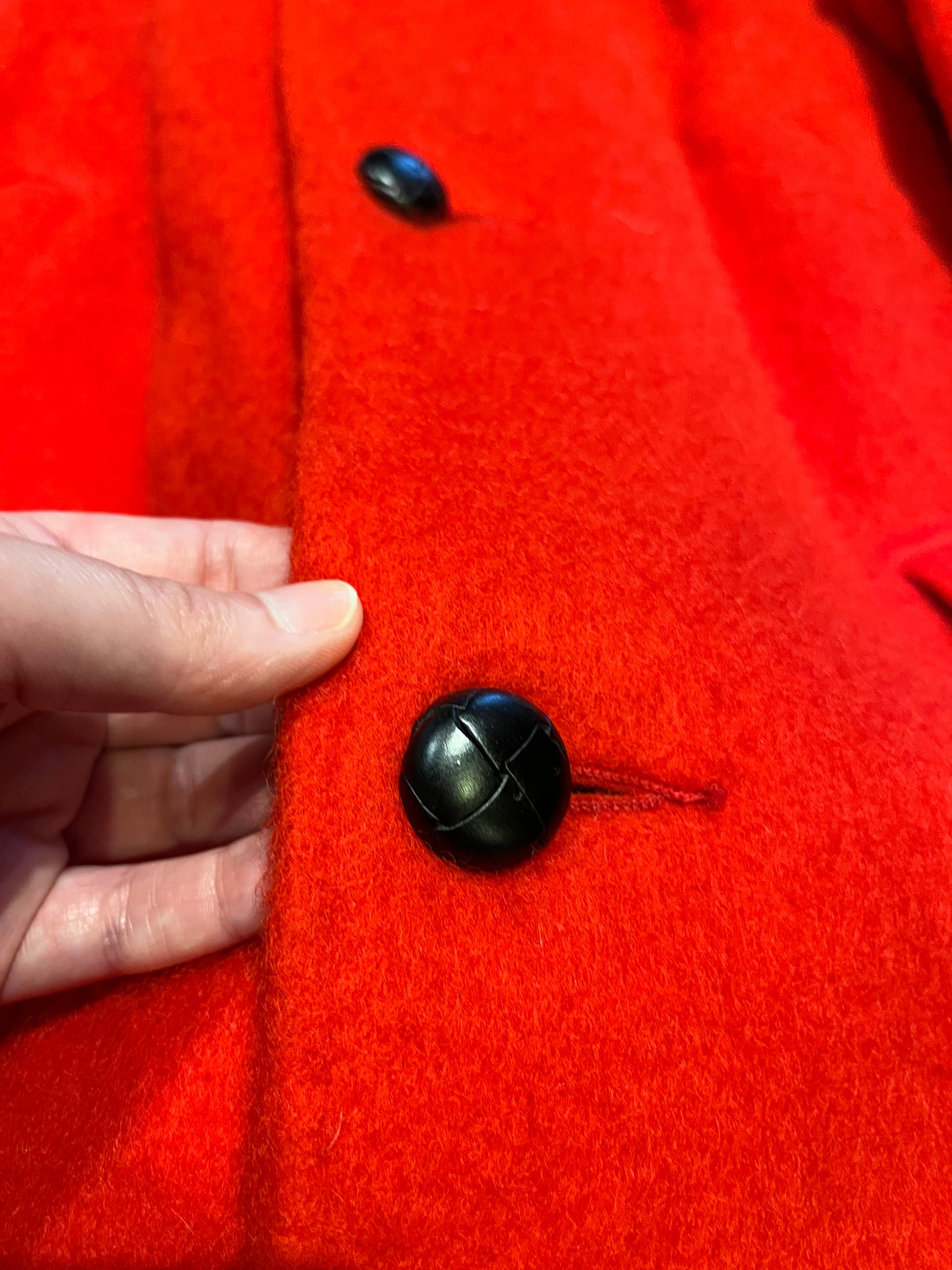 Genuine Hudson’s Bay Company 100% wool point blanket coat in bright red. The coat features flap pockets and hand warmer pockets, leather buttons, zip closure and a hood. 
Made in Canada. 
Size medium.