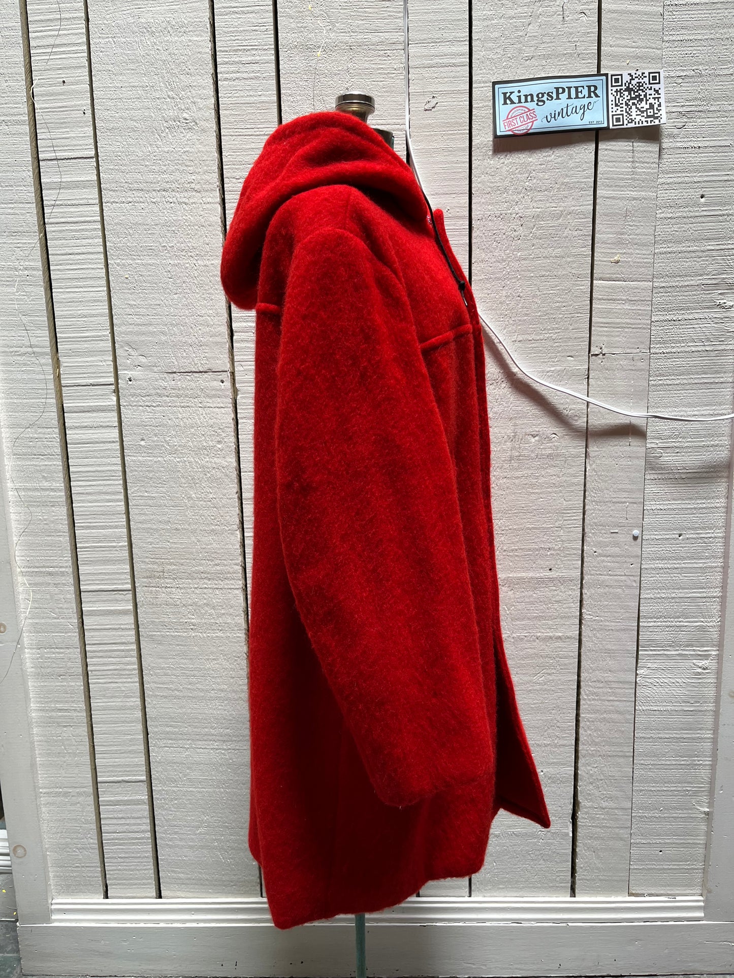 Genuine Hudson’s Bay Company 100% wool point blanket coat in bright red. The coat features flap pockets and hand warmer pockets, leather buttons, zip closure and a hood. 
Made in Canada. 
Size medium.