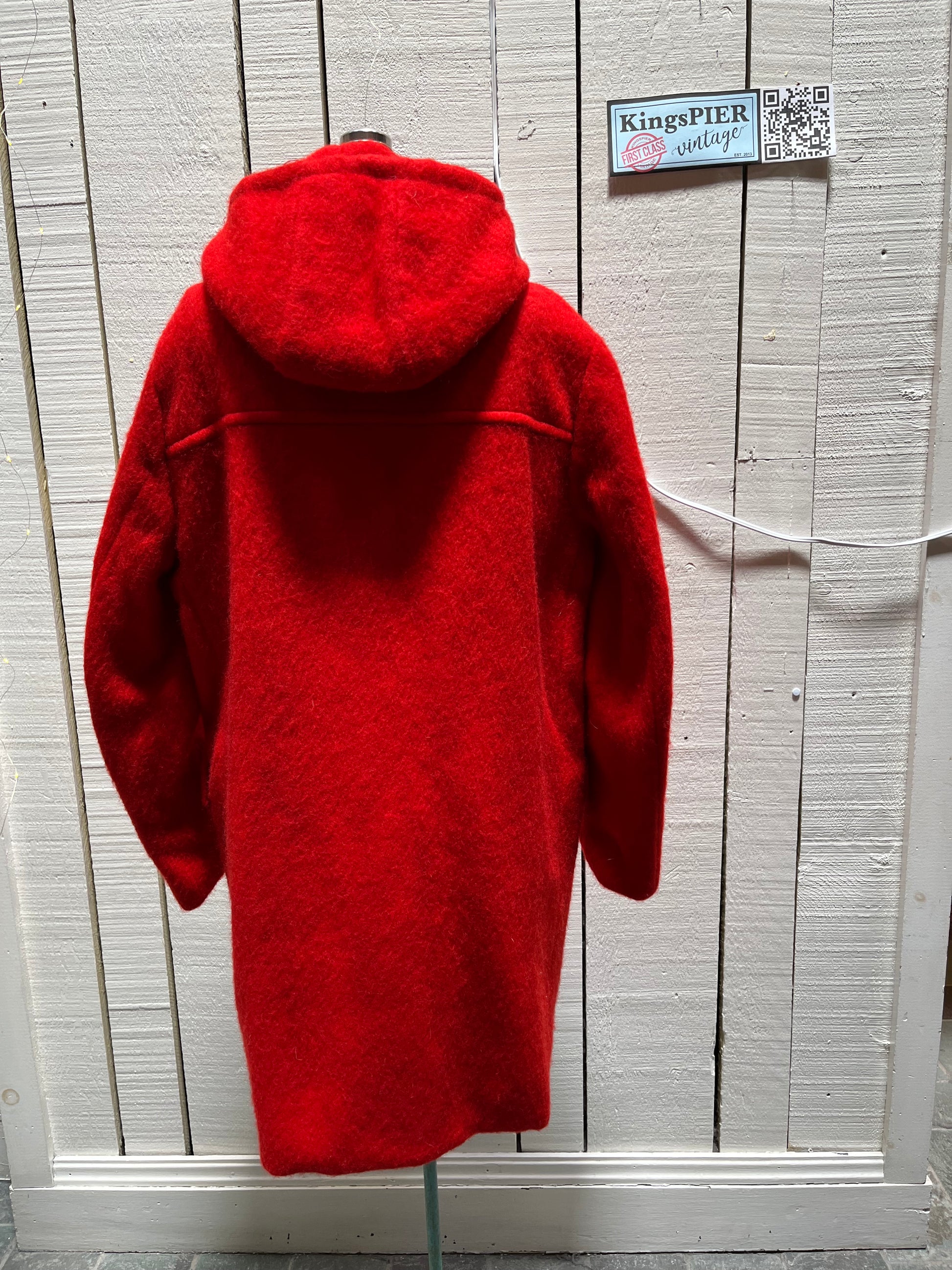 Genuine Hudson’s Bay Company 100% wool point blanket coat in bright red. The coat features flap pockets and hand warmer pockets, leather buttons, zip closure and a hood. 
Made in Canada. 
Size medium.