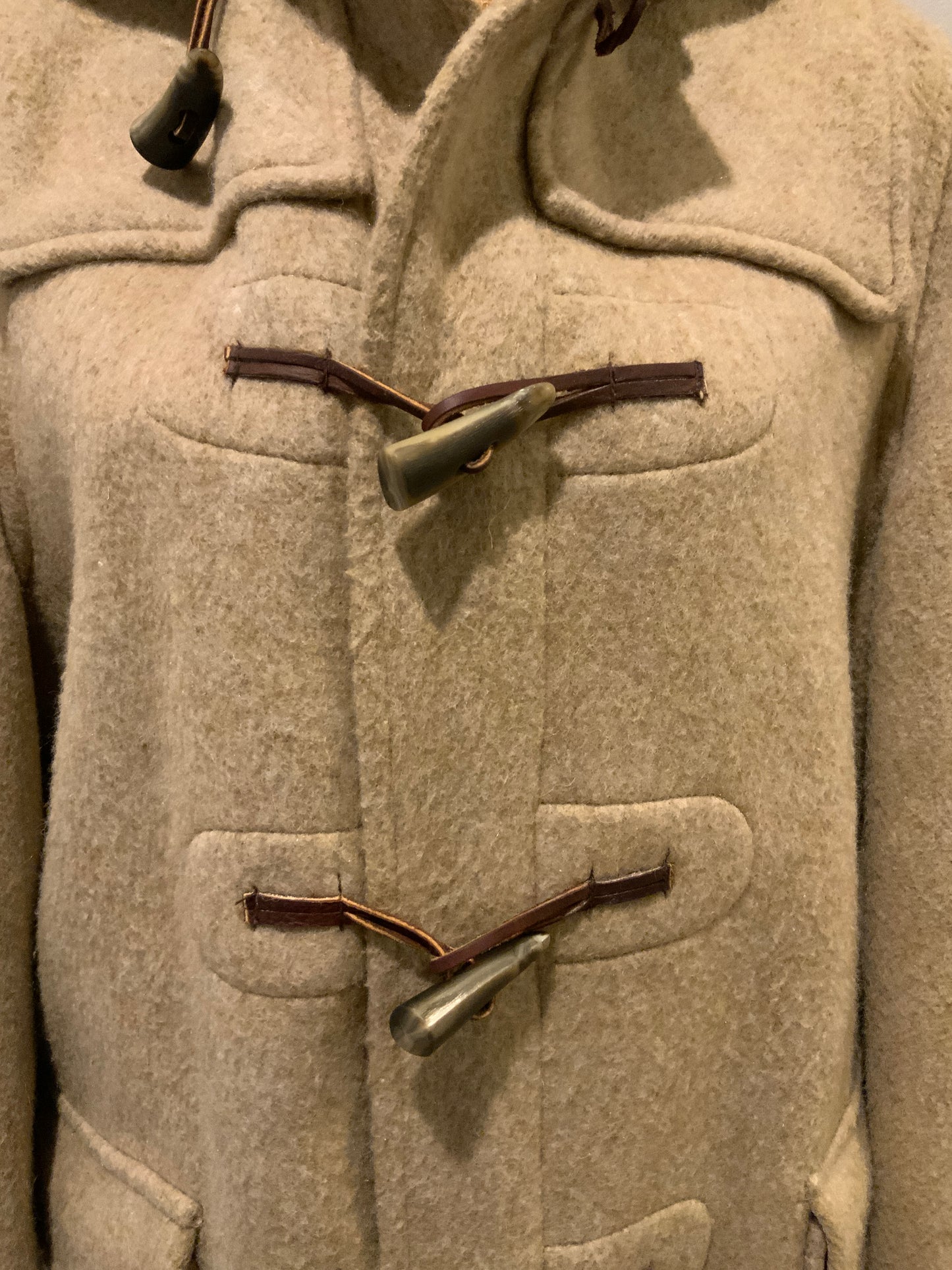 Kingspier Vintage - Tip Top beige textured wool duffle coat with hood, zipper, wooden toggles and flap pockets. Size 38.