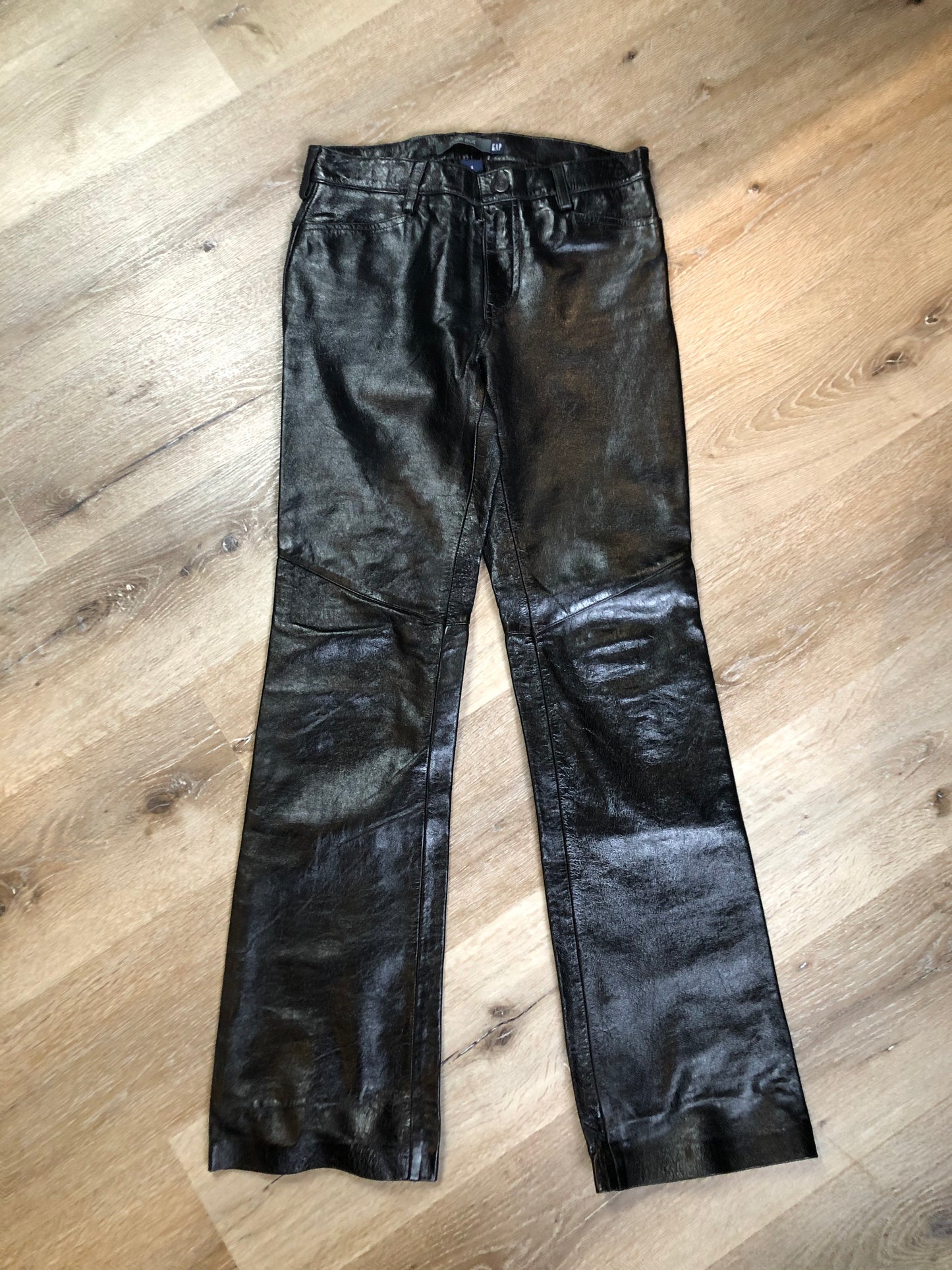 Vintage Gap black straight leg leather pants with zipper fly, and front and back pockets, partially lined. Size 4 (30x32).