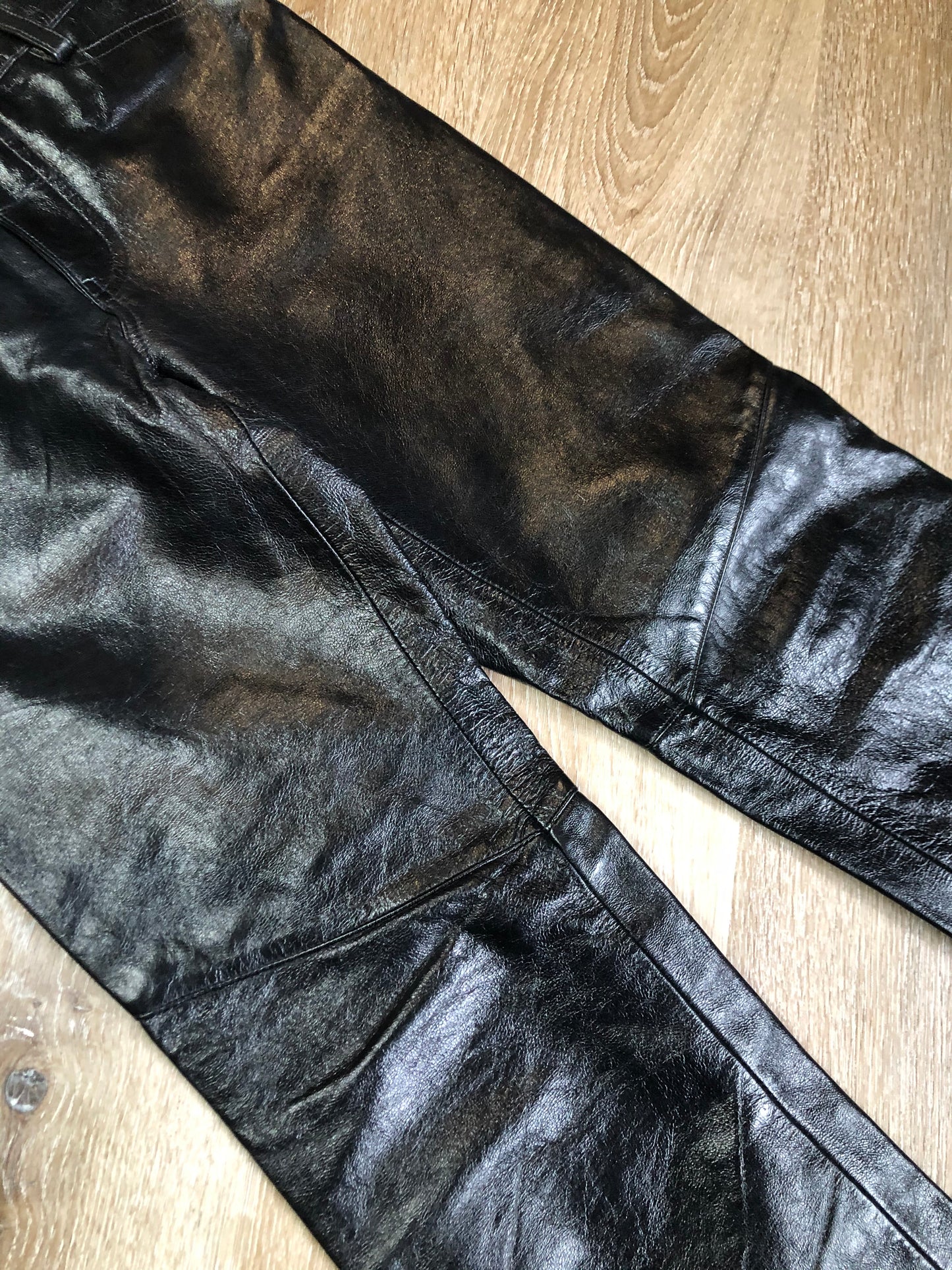 Vintage Gap black straight leg leather pants with zipper fly, and front and back pockets, partially lined. Size 4 (30x32).