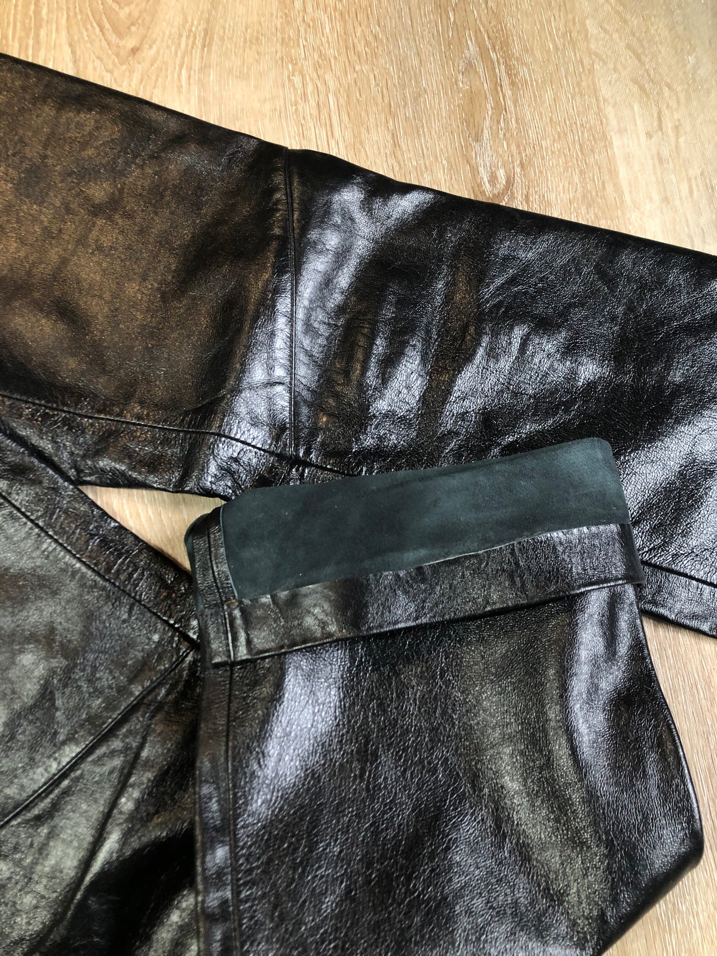 Vintage Gap black straight leg leather pants with zipper fly, and front and back pockets, partially lined. Size 4 (30x32).