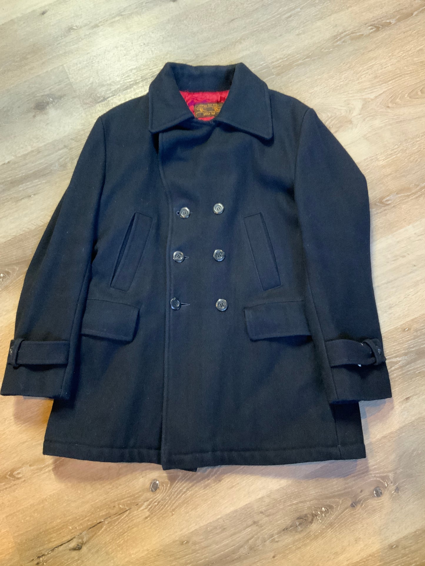 Kingspier Vintage - The Bay navy blue wool blend peacoat with front welt pockets and flap pockets plus a raspberry colour quilted lining. Made in Canada. Size 40.