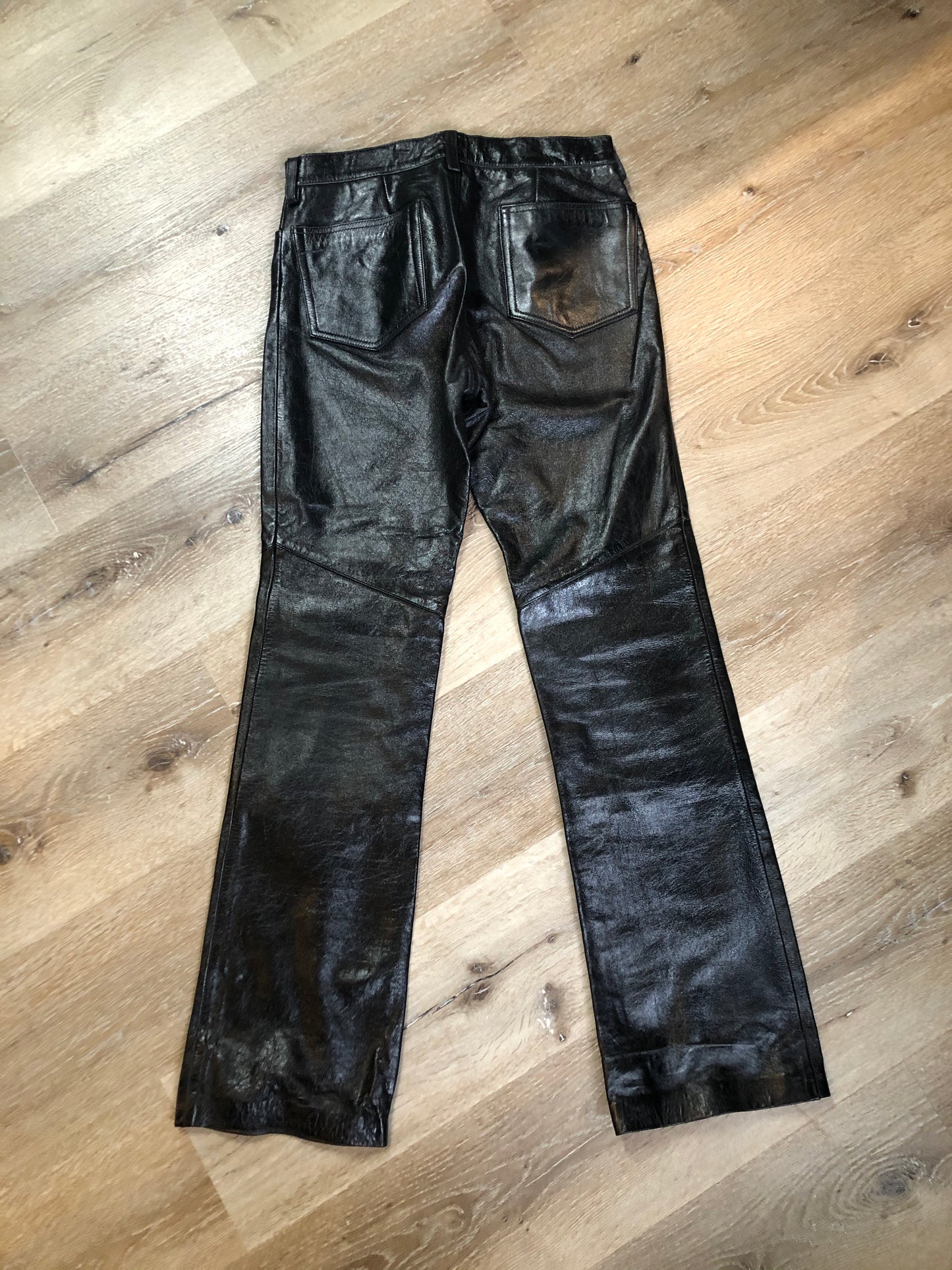 Vintage Gap black straight leg leather pants with zipper fly, and front and back pockets, partially lined. Size 4 (30x32).