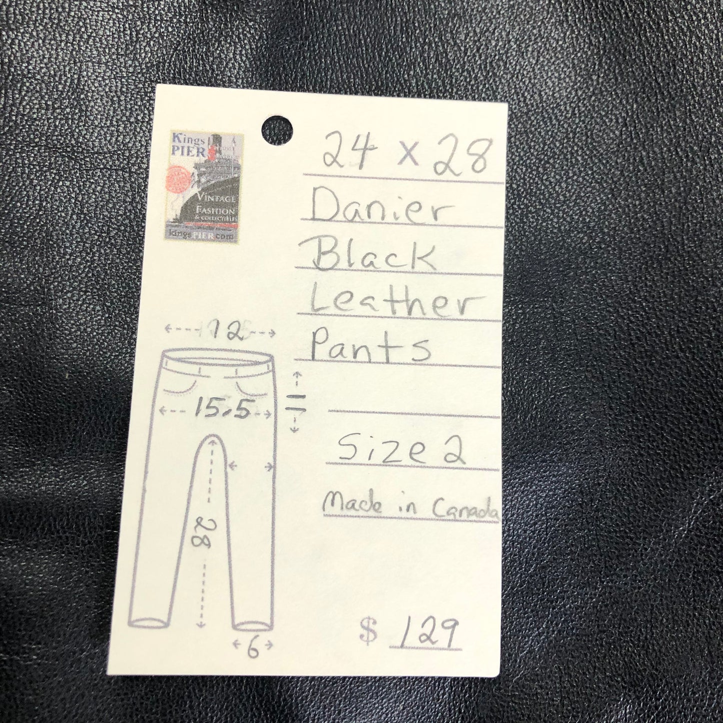 Danier black leather tapered leg pants with size zip closure, partially lined. Made in Canada. Size 2 (24x28).