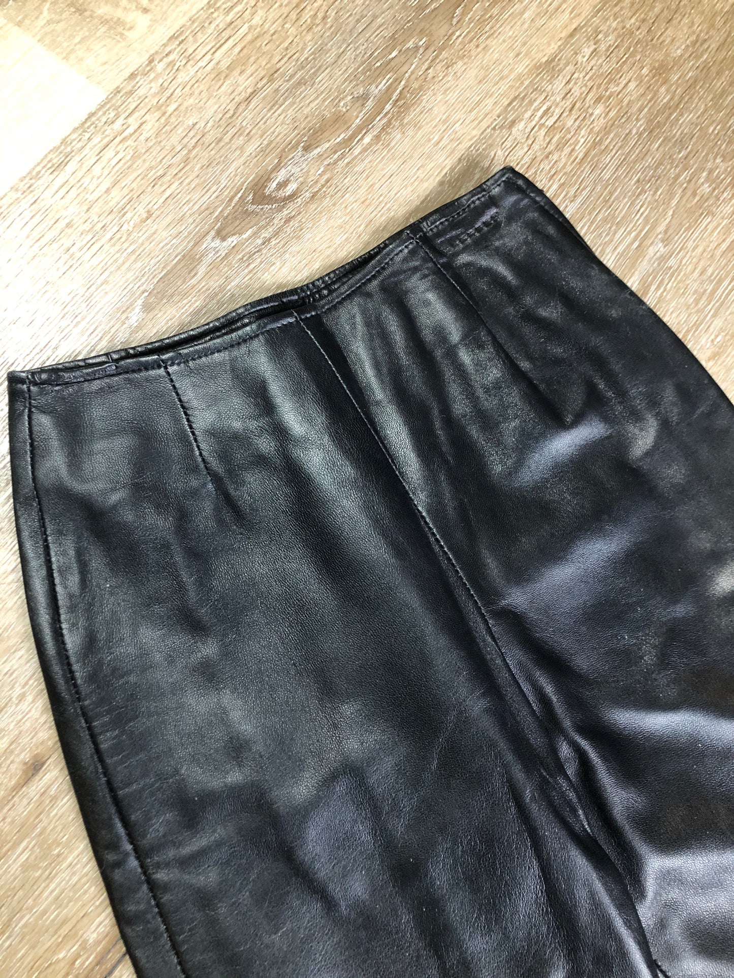 Danier black leather tapered leg pants with size zip closure, partially lined. Made in Canada. Size 2 (24x28).