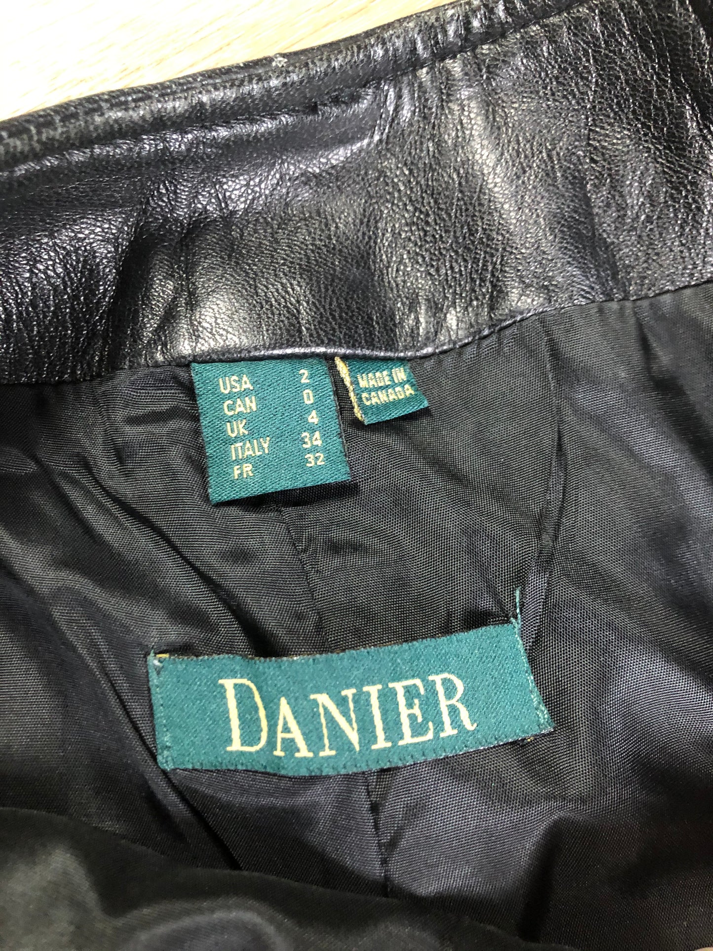 Danier black leather tapered leg pants with size zip closure, partially lined. Made in Canada. Size 2 (24x28).