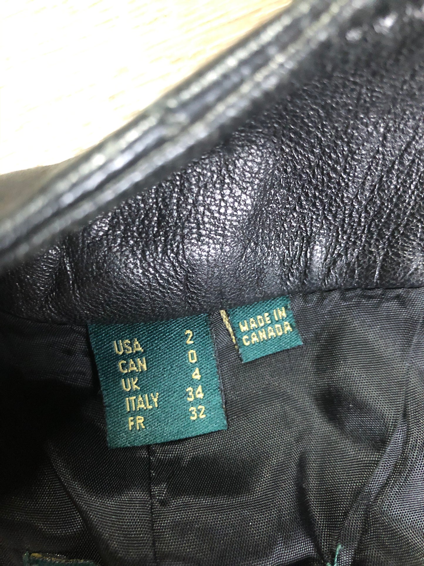 Danier black leather tapered leg pants with size zip closure, partially lined. Made in Canada. Size 2 (24x28).