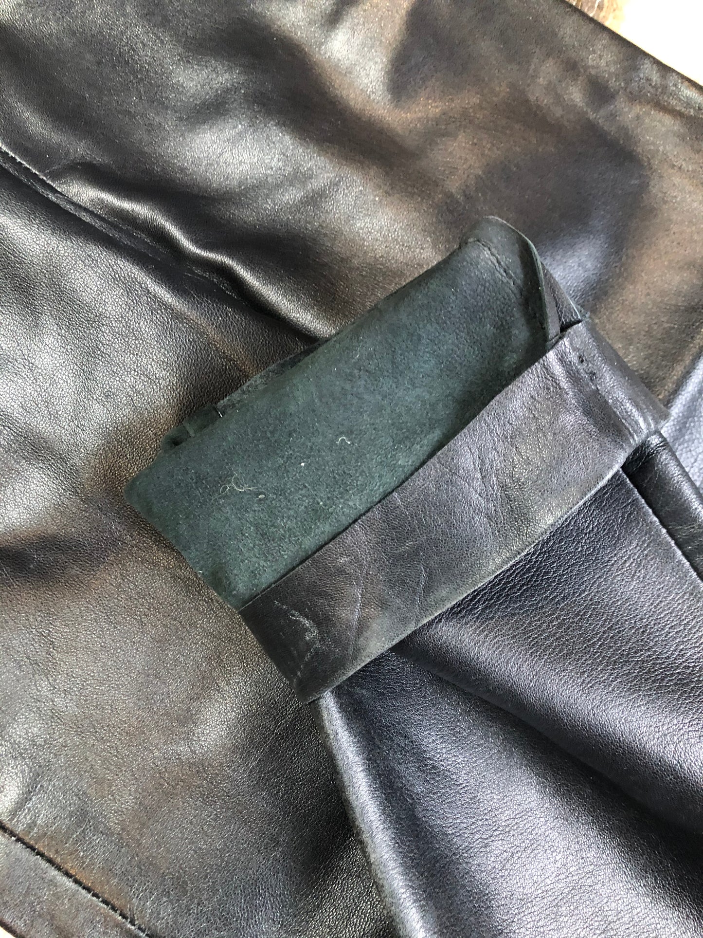 Danier black leather tapered leg pants with size zip closure, partially lined. Made in Canada. Size 2 (24x28).