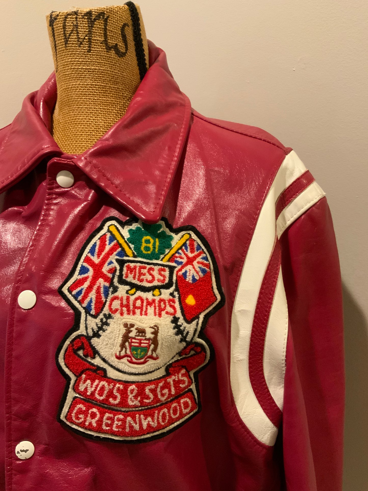 Kingspier Vintage - Mess Champs (Greenwood) Baseball red letterman’s jacket with white stripes , embroidered emblem on chest, snap closures and slash pockets. Size 42.