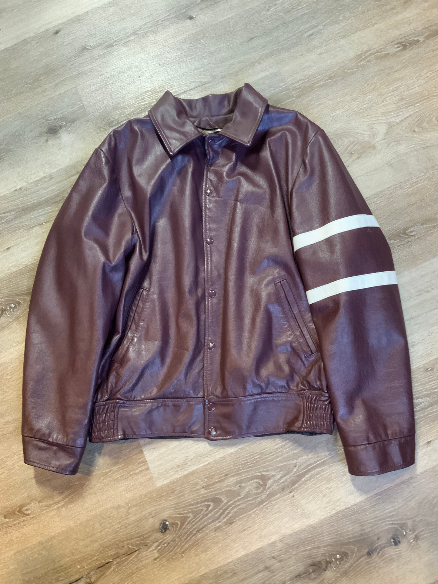 Kingspier Vintage - Saint Mary’s Letterman Jacket in Burgundy with “Saint Mary’s” written across the back, snap closures, slash buttons, zip out lining and inside pocket. Made in Canada. Size 44.