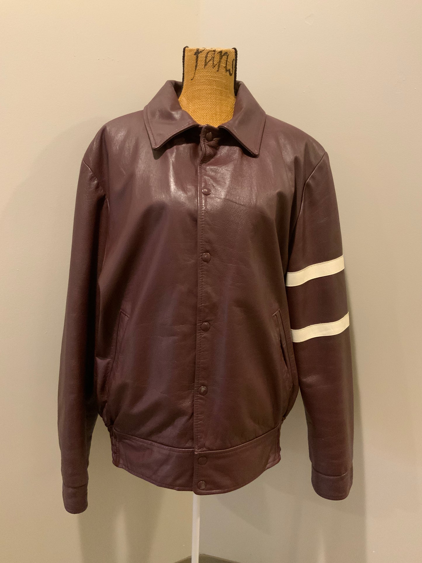 Kingspier Vintage - Saint Mary’s Letterman Jacket in Burgundy with “Saint Mary’s” written across the back, snap closures, slash buttons, zip out lining and inside pocket. Made in Canada. Size 44.