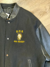 Load image into Gallery viewer, Kingspier Vintage - Dartmouth High School AAA Hockey letterman’s jacket in black with snap closures, slash pockets, quilted lining and embroidered team emblem. Made in Canada. Size XL.
