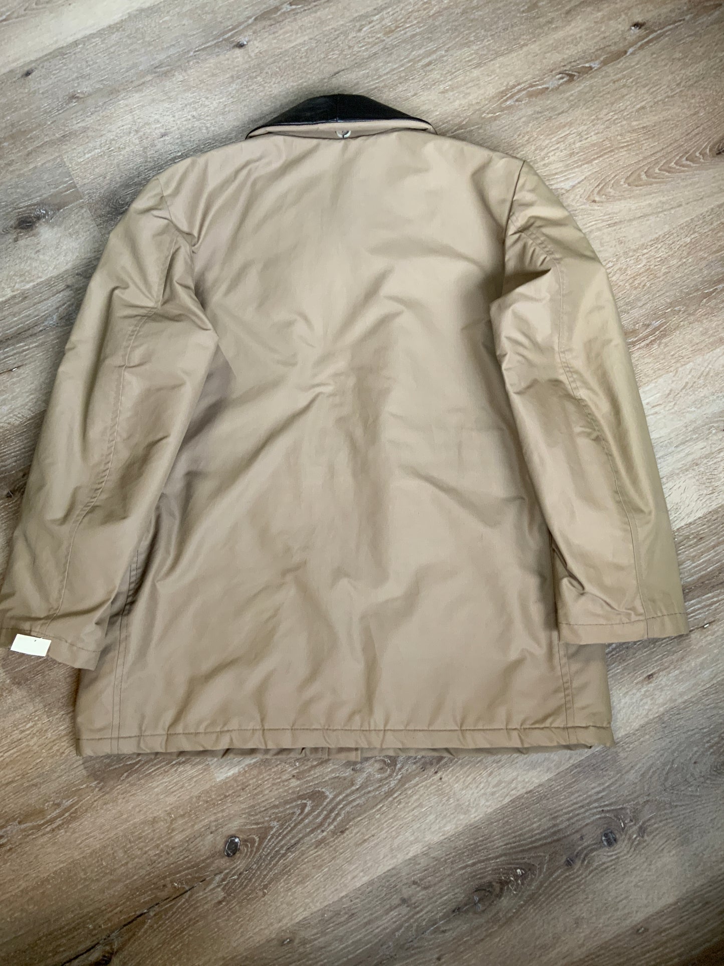 Kingspier Vintage - Special Reserve hunting jacket in beige with brown leather collar featuring a strap to keep your collar in place, zipper, three flap pockets and one zip pocket. Knit inside cuffs. lined for cooler weather with drawstring at waist. Made in Canada. Size 44.