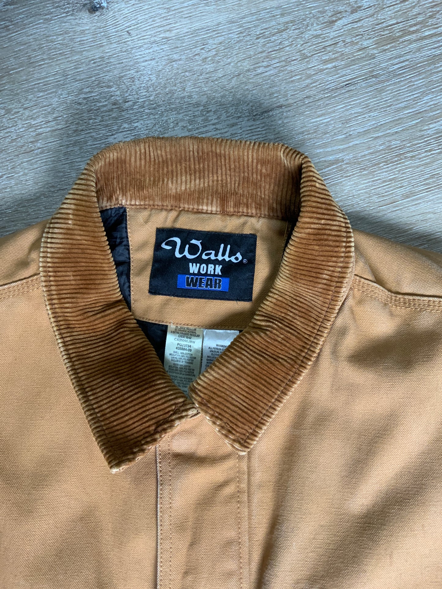 Kingspier Vintage - Wall’s Work Wear canvas work jacket with brown corduroy collar, zipper and snap closures, two front patch pockets and flap pockets, inside quilted lining with knit inside cuffs to keep the cold from getting in.