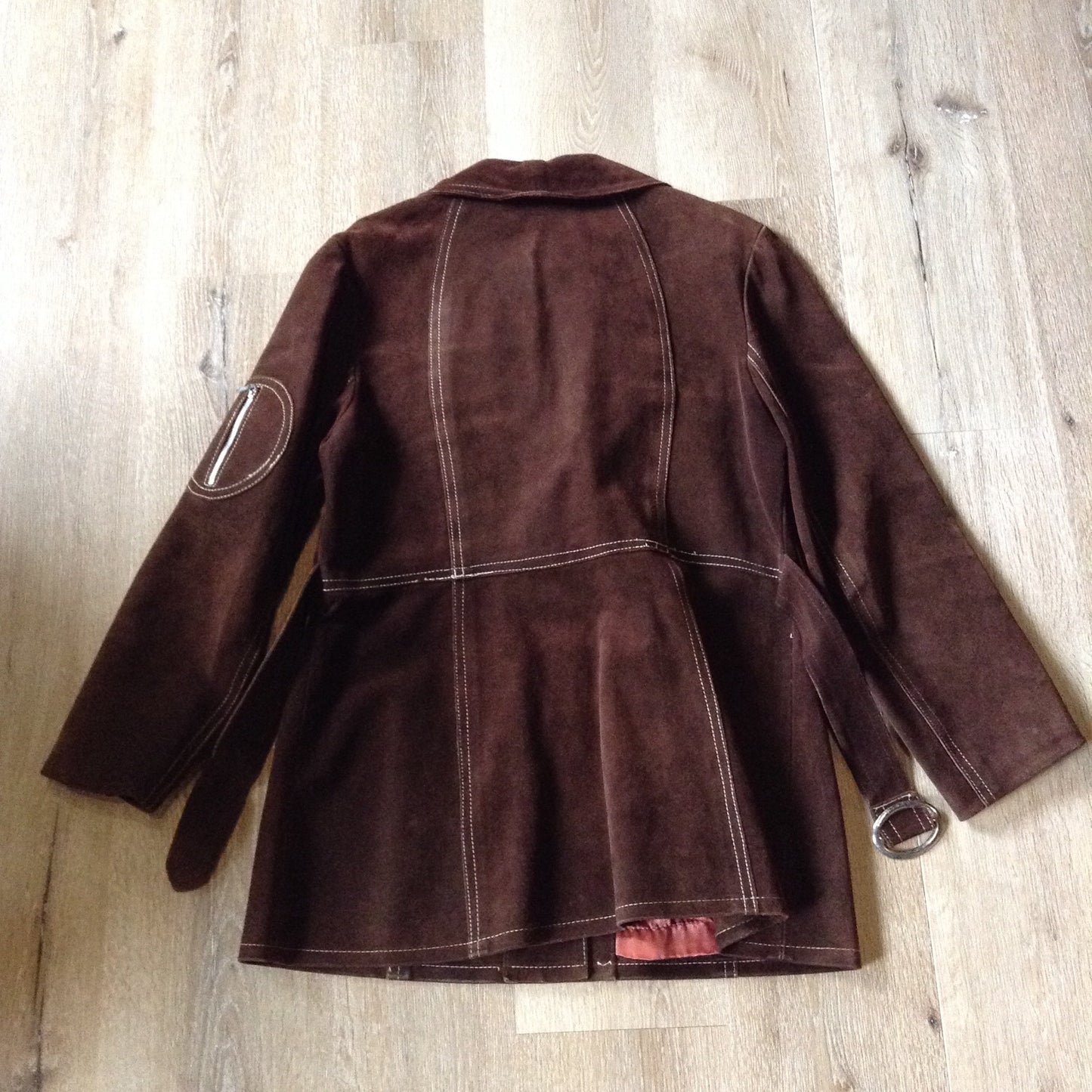 Kingspier Vintage - Vintage Sylvia Mark brown suede belted jacket with snap closures, decorative stitching, unique round pockets and pink satin lining. Made in Canada. Size Medium.