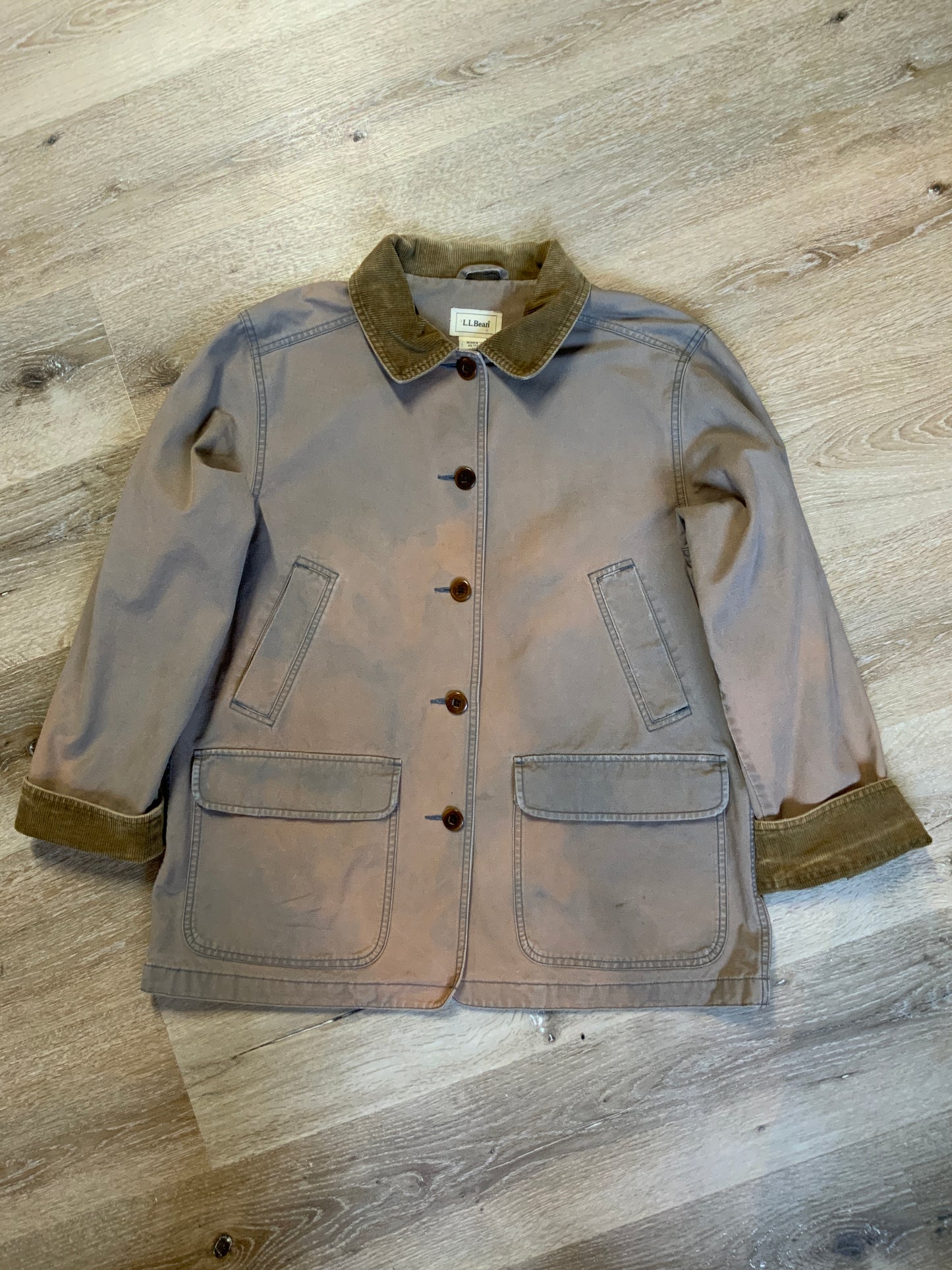 Kingspier Vintage - LL Bean distressed purple chore jacket with beige corduroy collar and cuffs, two slash pockets for keeping your hands warm, two flap pockets and button closures. Size petite Large.
