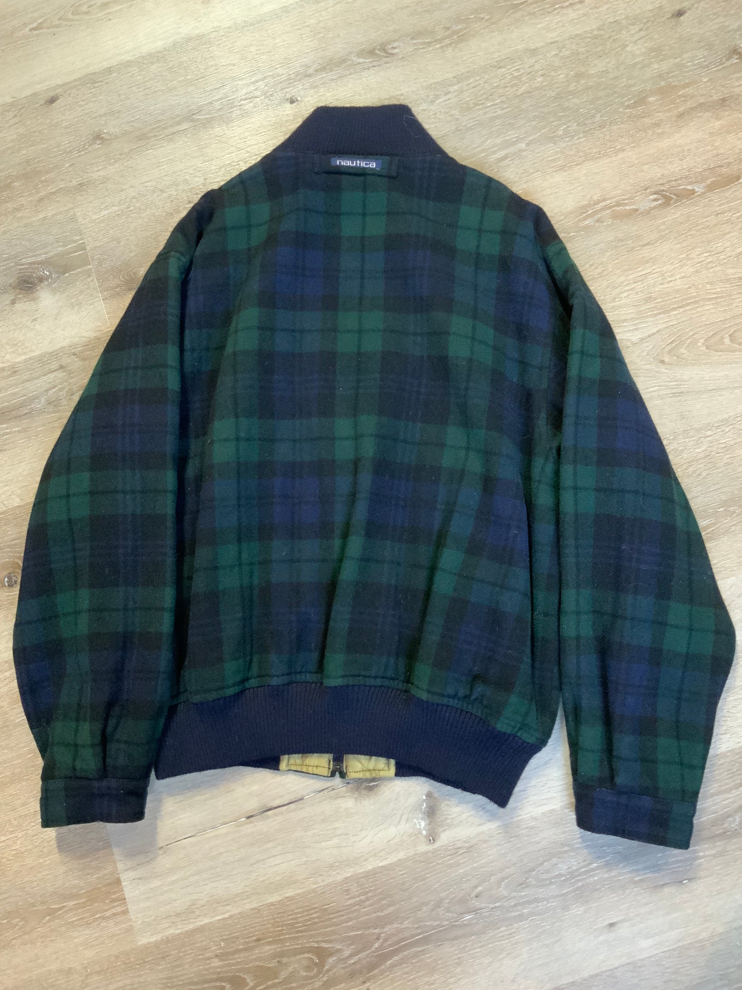Kingspier Vintage - Nautica green and black “black watch” tartan wool jacket with knit trim collar, zipper, slash pockets and quilted lining. Size XL.