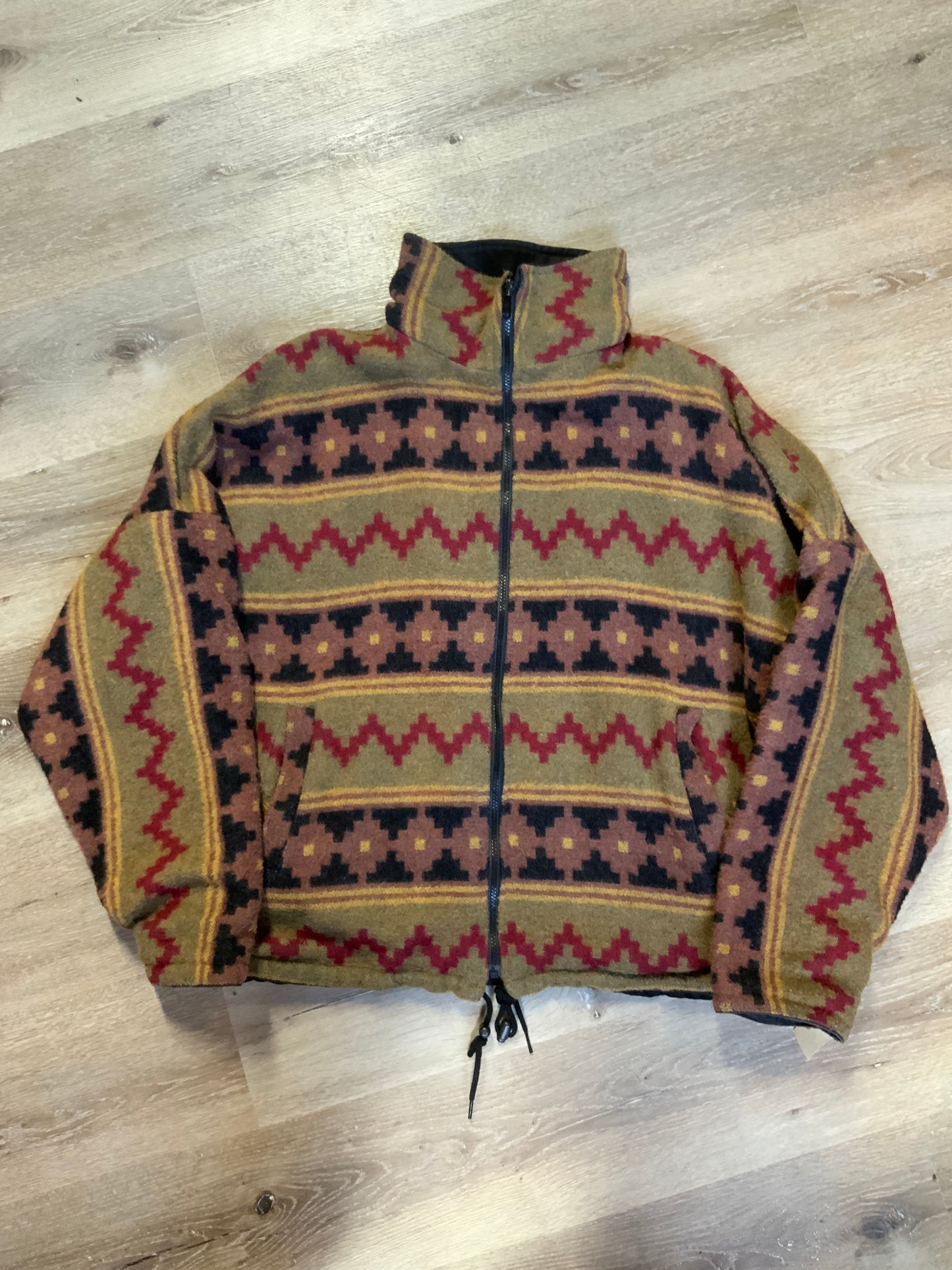 Kingspier Vintage - Reversible jacket with one side black denim and one side colourful green, red, purple ,yellow and black design, front zipper, slash pockets and a drawstring at the waist.