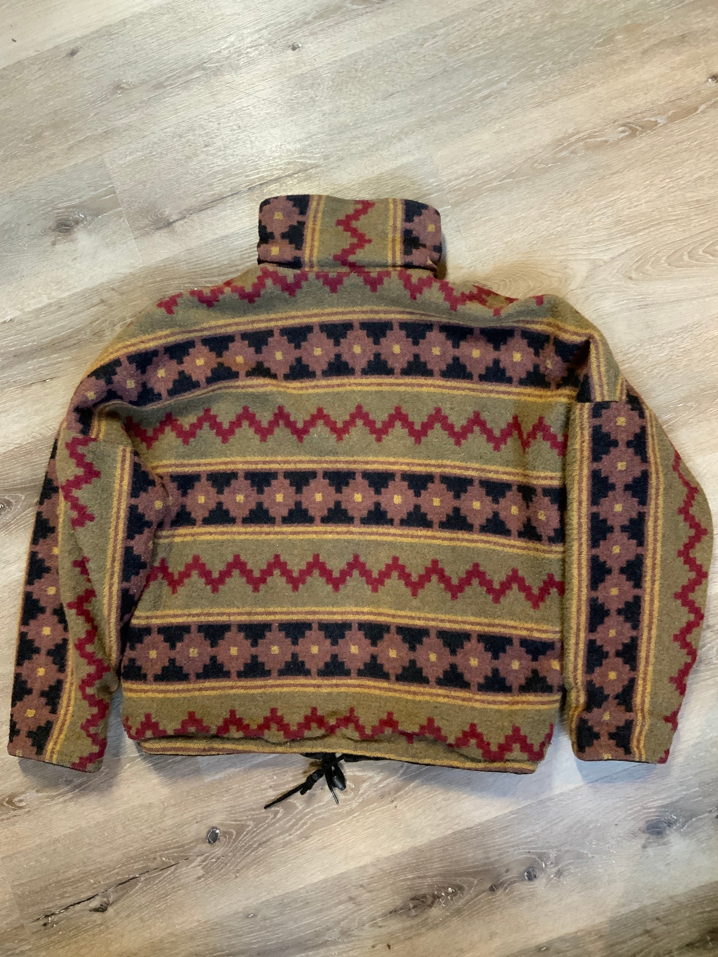 Kingspier Vintage - Reversible jacket with one side black denim and one side colourful green, red, purple ,yellow and black design, front zipper, slash pockets and a drawstring at the waist.