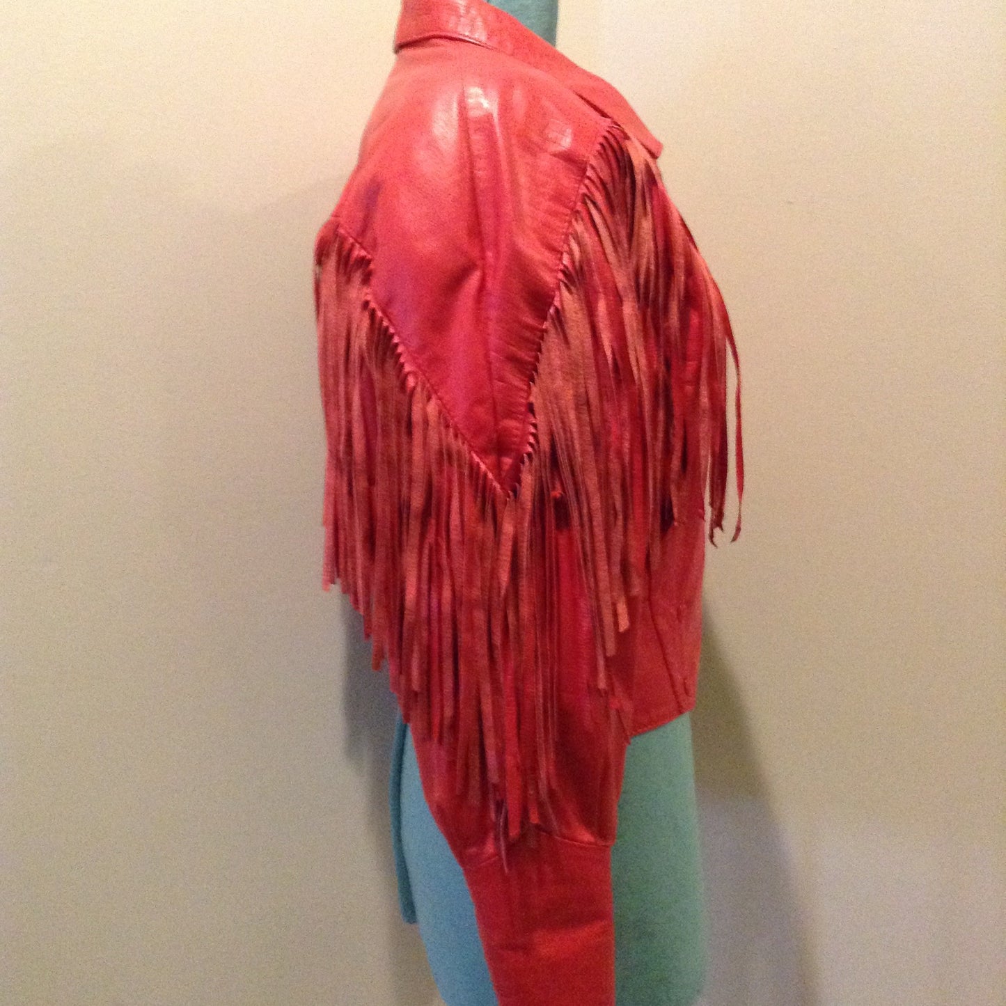 Kingspier Vintage - The Leather Ranch red fringe leather jacket with snap closures and red satin lining . Made in Canada, size XL.