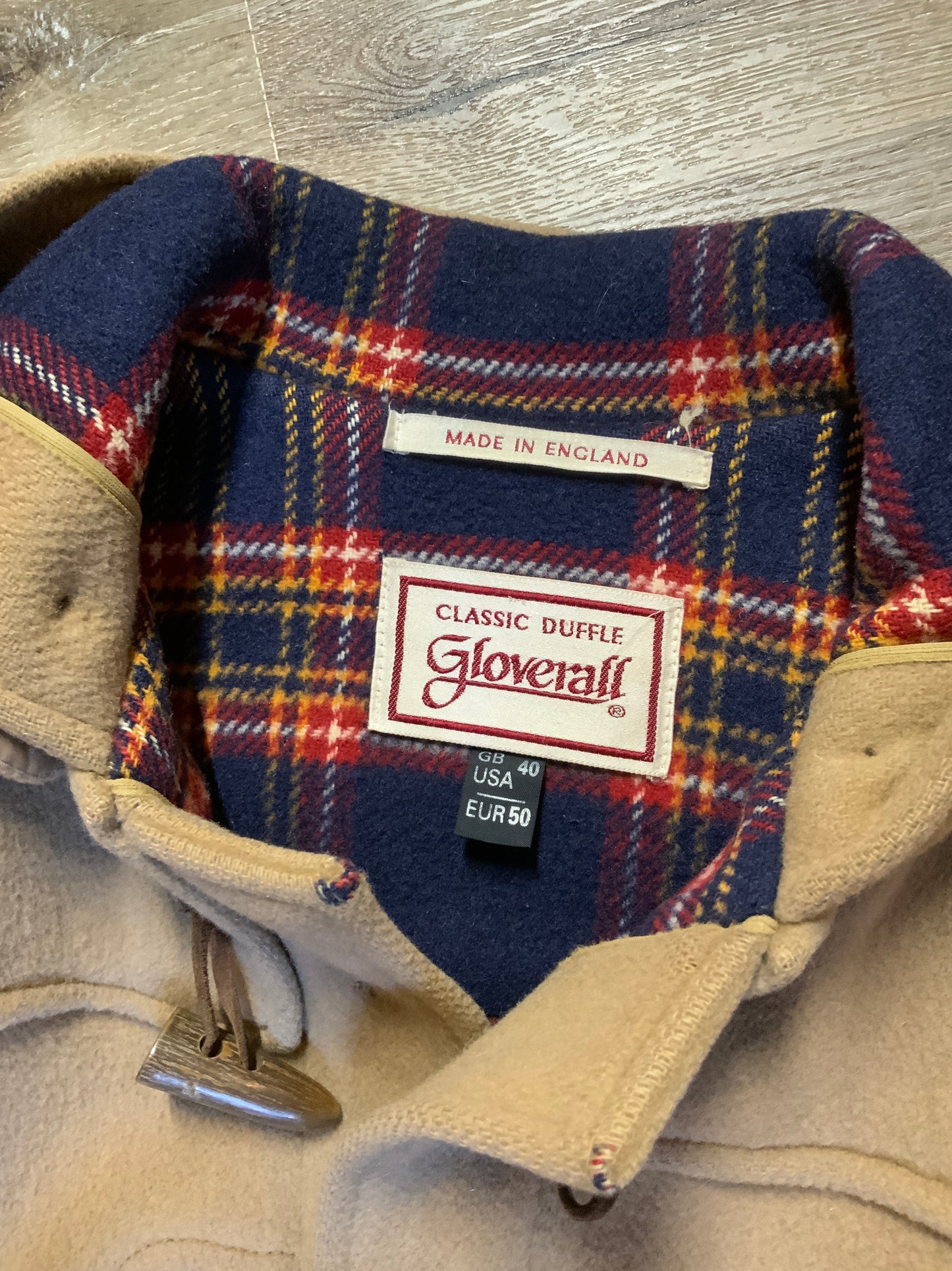 Kingspier Vintage - Gloverall Tan wool blend coat with hood, zipper, flap pockets and plaid lining. Made in England. Size 40.