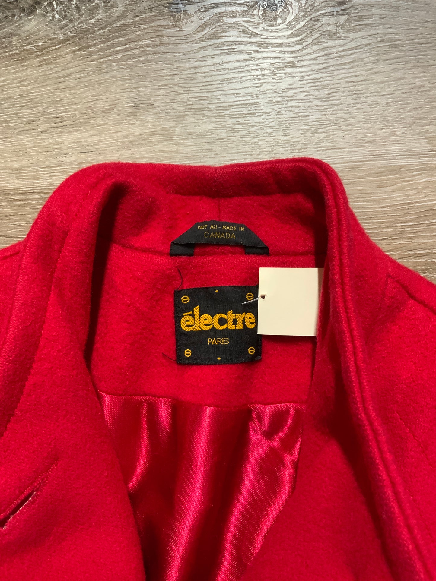 Kingspier Vintage - Electre Paris red wool car coat with red button closures, welt pockets and subtle detailing on shoulders. Made in Canada