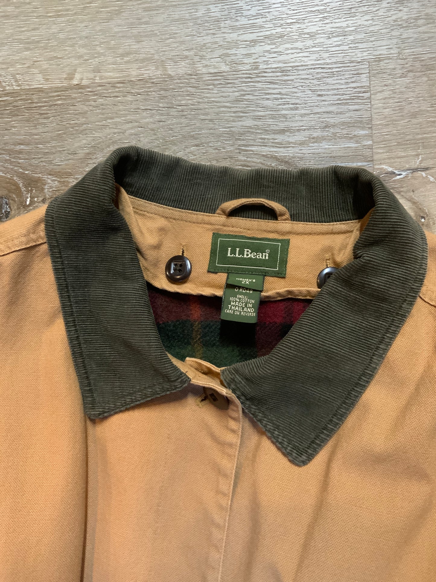 Kingspier Vintage - L.L.Bean tan field jacket with green corduroy collar and cuff, four front patch pockets button closures, removable plaid wool blend liner. Size 2XL women’s.