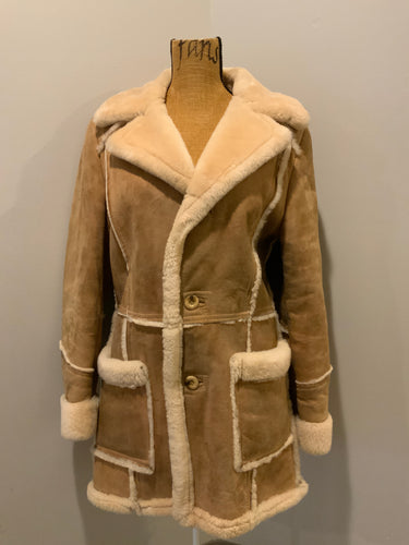 Kingspier Vintage - Leather Attic light brown sheepskin coat with shearling trim and lining, button closures and patch pockets.