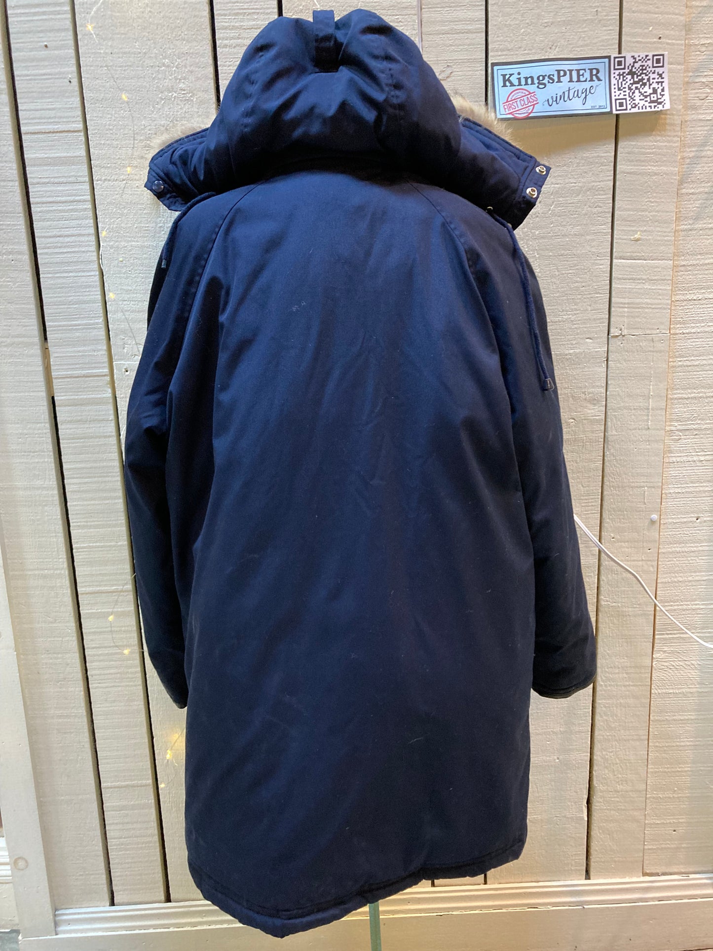 Kingspier Vintage - Vintage Northern Spirit navy blue down-filled parka with coyote fur trimmed removable hood, leather trim, zipper closure and front flap pockets.