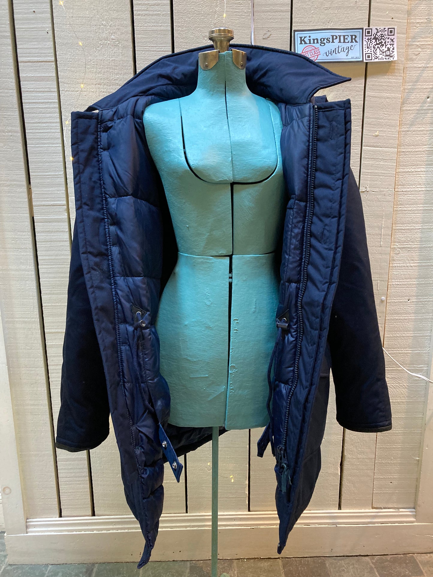 Kingspier Vintage - Vintage Northern Spirit navy blue down-filled parka with coyote fur trimmed removable hood, leather trim, zipper closure and front flap pockets.