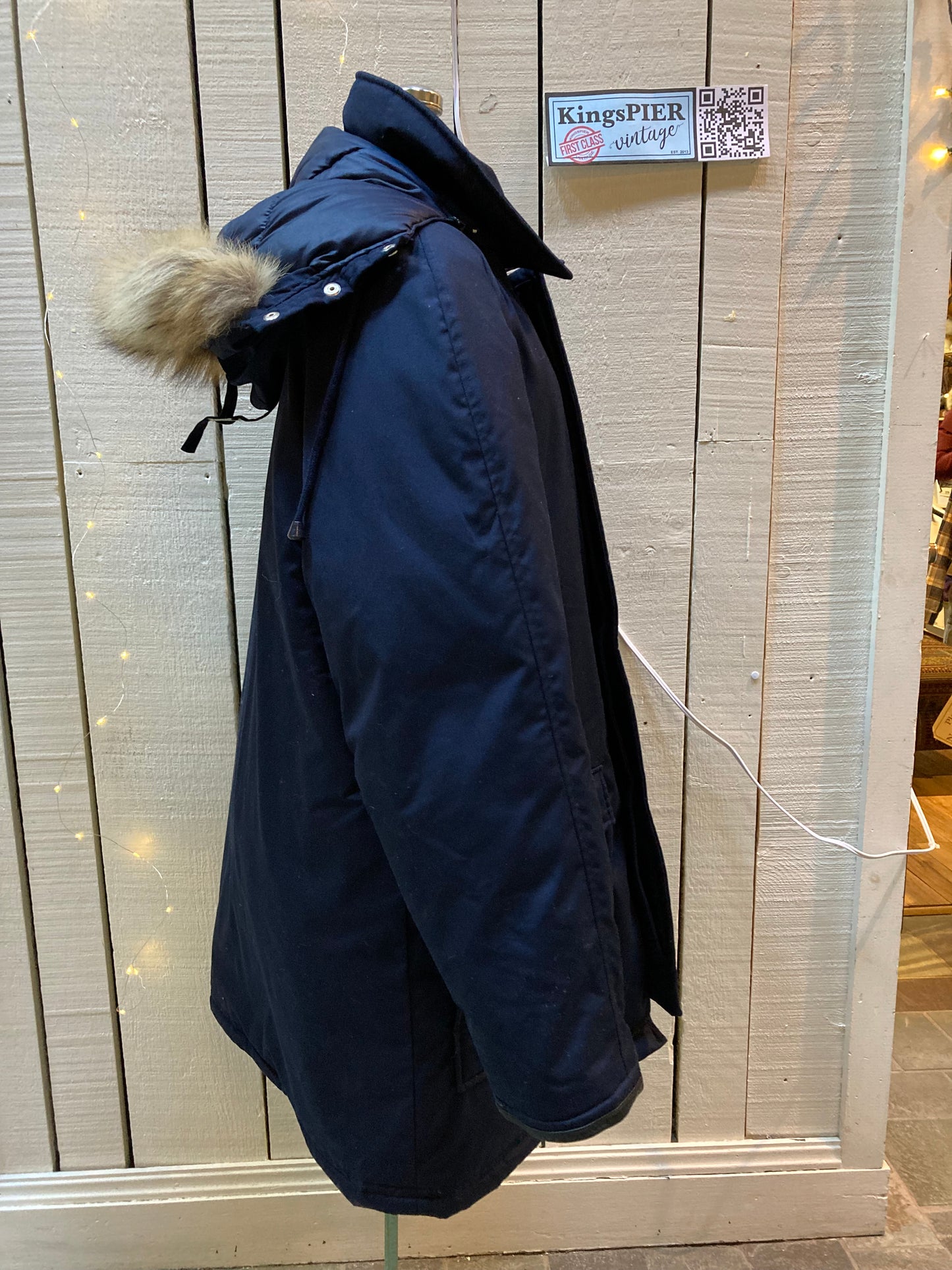Kingspier Vintage - Vintage Northern Spirit navy blue down-filled parka with coyote fur trimmed removable hood, leather trim, zipper closure and front flap pockets.