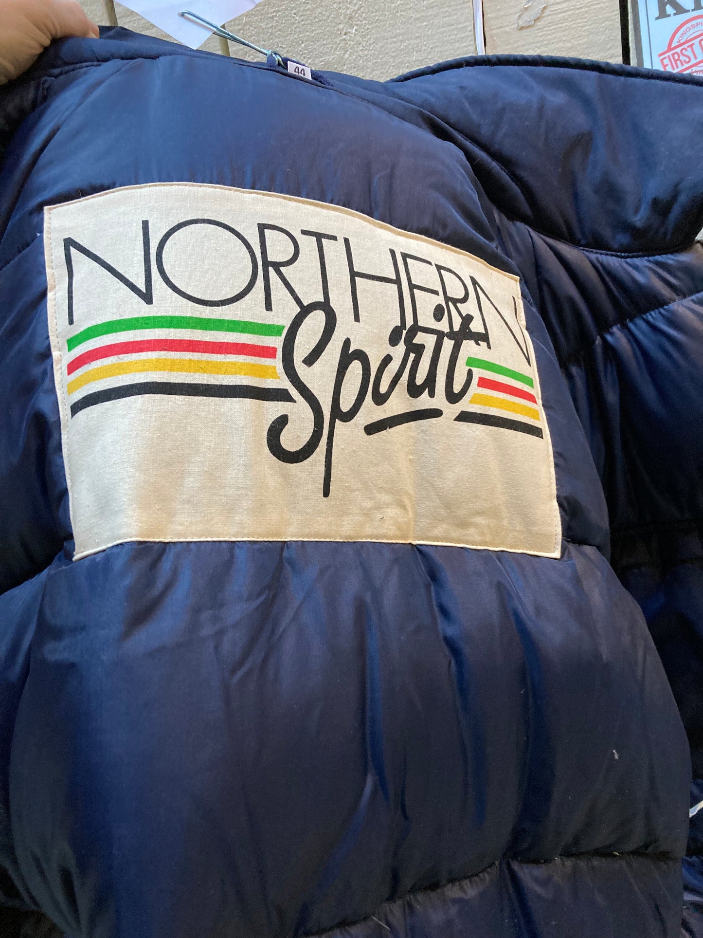 Kingspier Vintage - Vintage Northern Spirit navy blue down-filled parka with coyote fur trimmed removable hood, leather trim, zipper closure and front flap pockets.