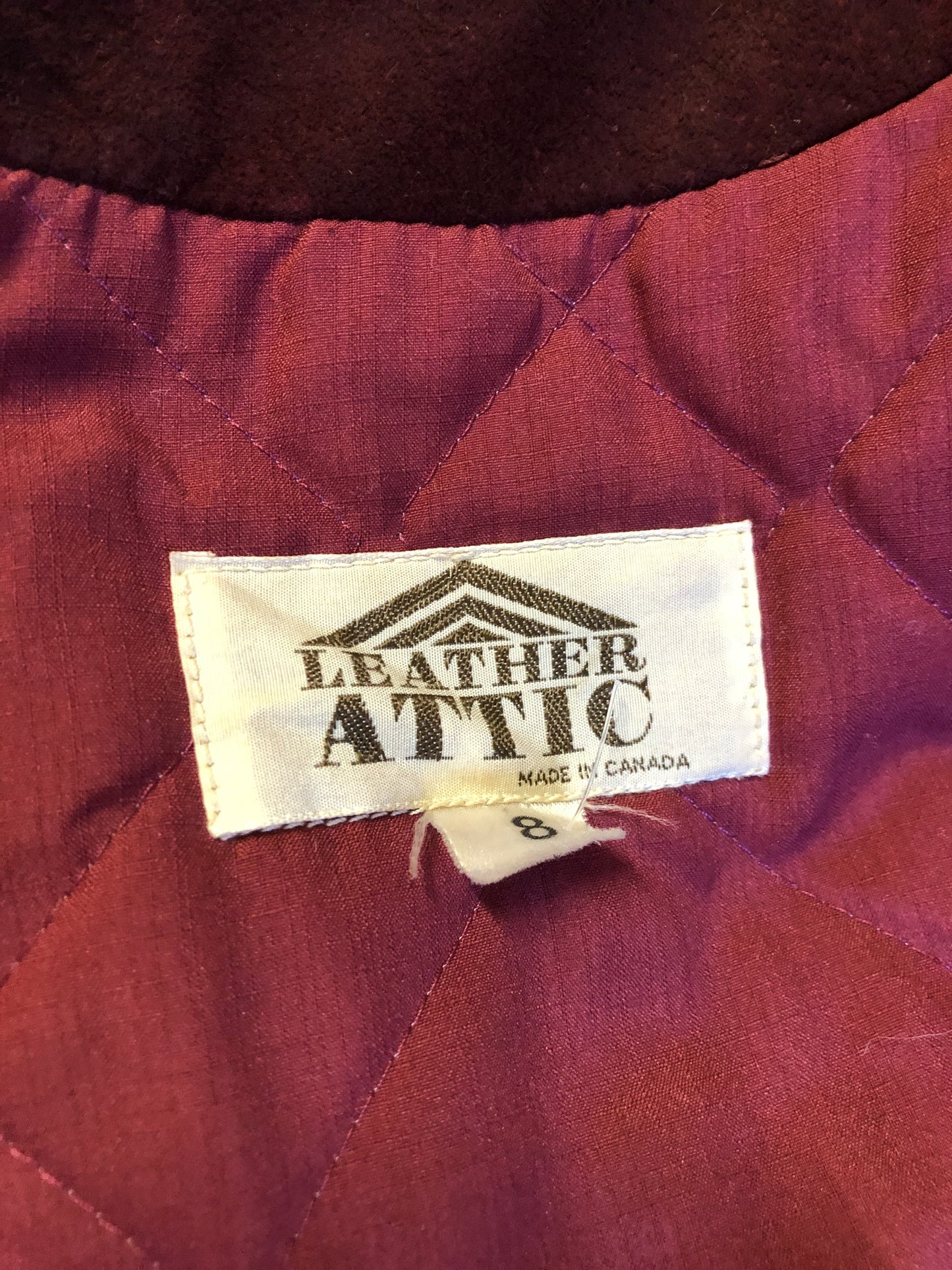 Kingspier Vintage - Leather Attic 1970’s oxblood suede coat with fur collar. Beautifully fitted, the coat features pockets, buttons, a belt and a quilted lining. Made in Canada. Size small.