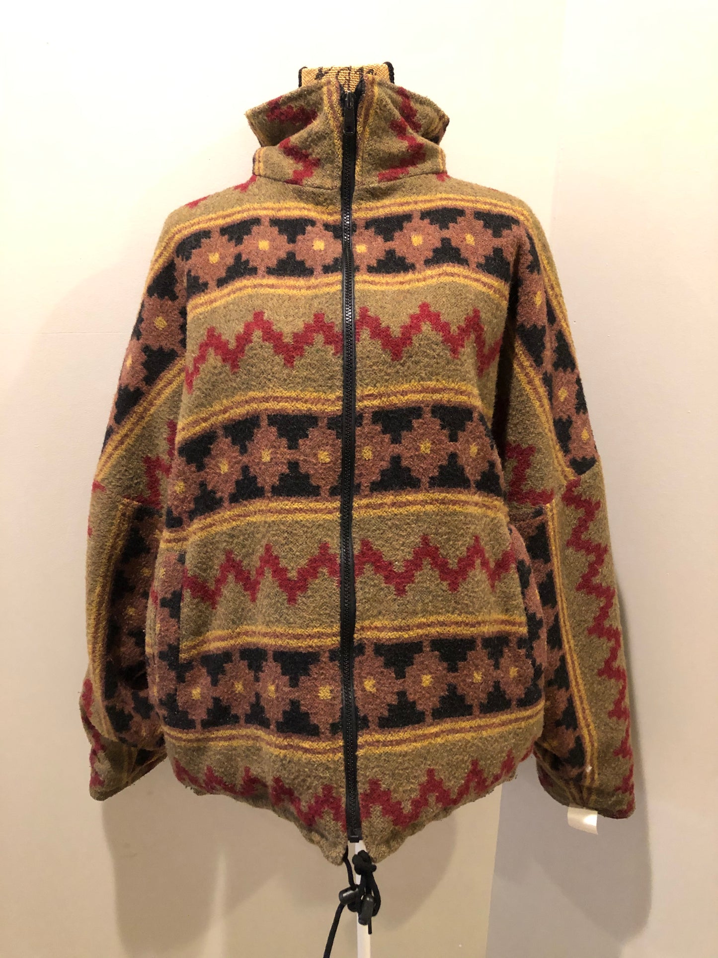 Kingspier Vintage - Reversible jacket with one side black denim and one side colourful green, red, purple ,yellow and black design, front zipper, slash pockets and a drawstring at the waist.