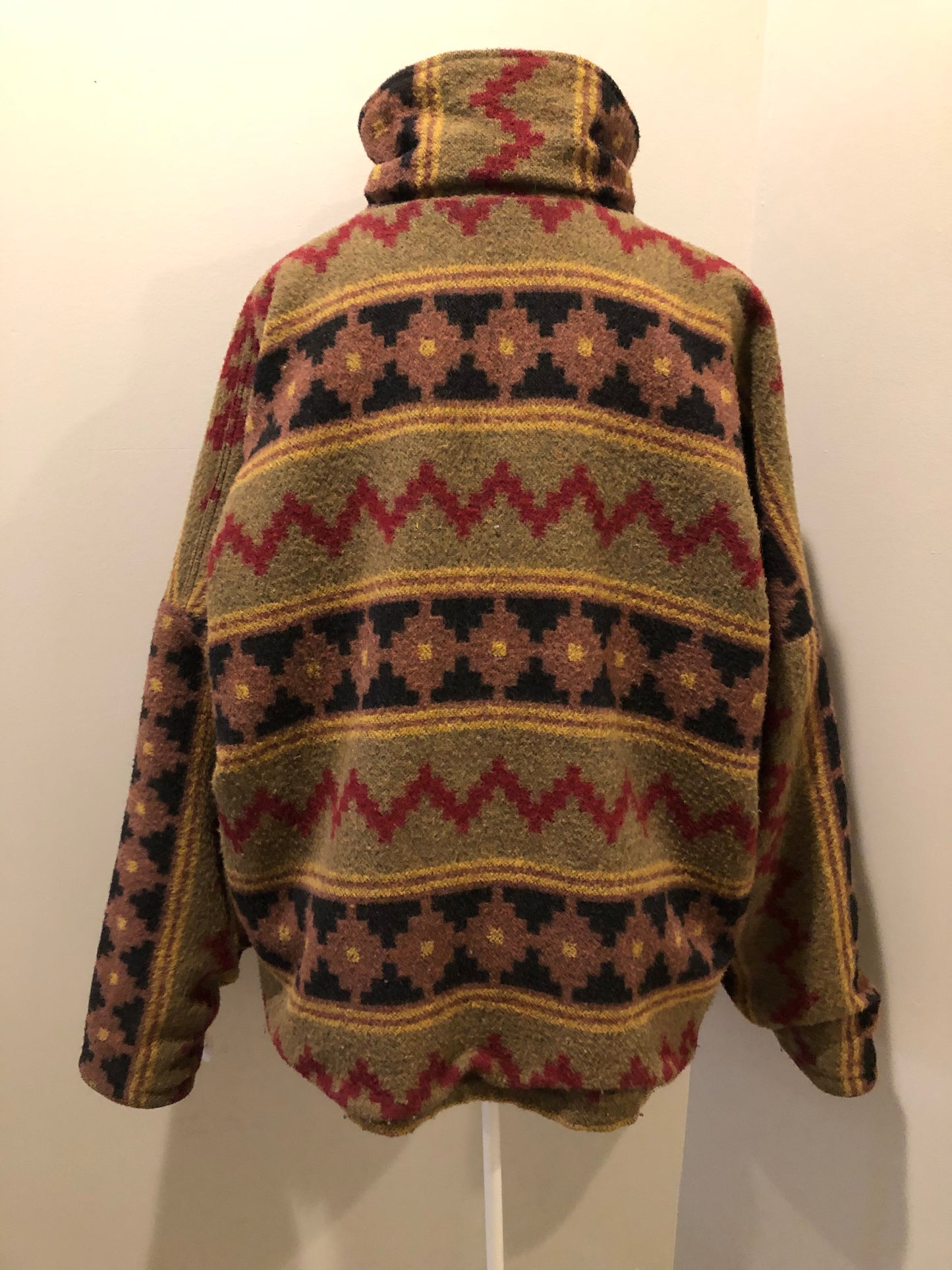 Kingspier Vintage - Reversible jacket with one side black denim and one side colourful green, red, purple ,yellow and black design, front zipper, slash pockets and a drawstring at the waist.