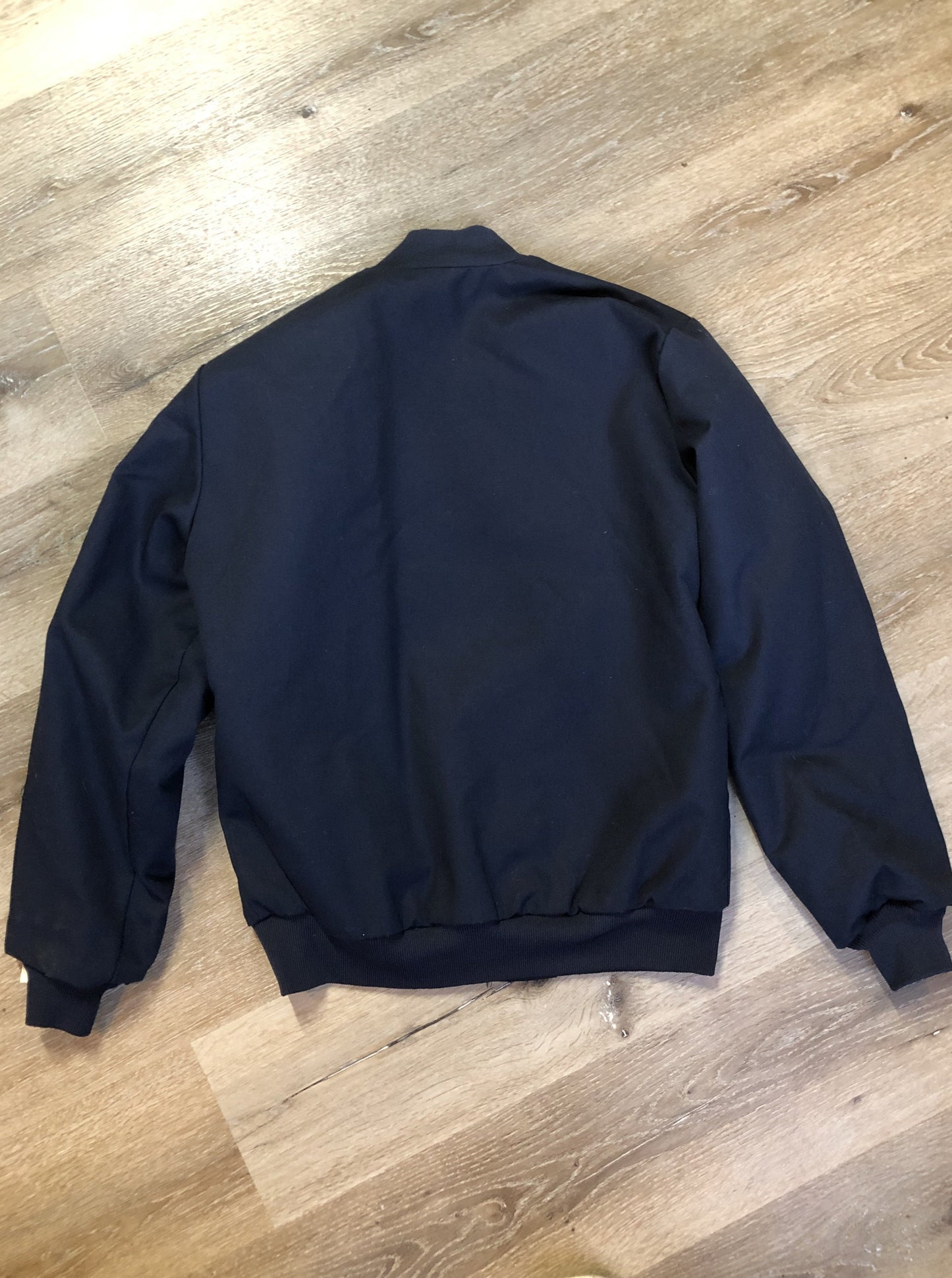 Kingspier Vintage - Red Kap bomber jacket in navy with knit collar and cuffs, zipper, slash pockets, and quilted lining. Made in the USA.
