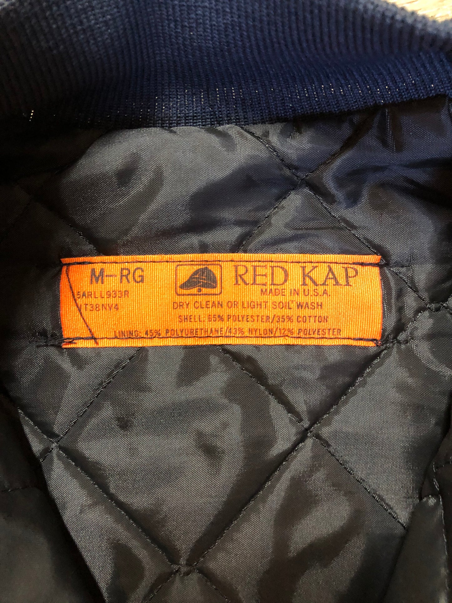 Kingspier Vintage - Red Kap bomber jacket in navy with knit collar and cuffs, zipper, slash pockets, and quilted lining. Made in the USA.