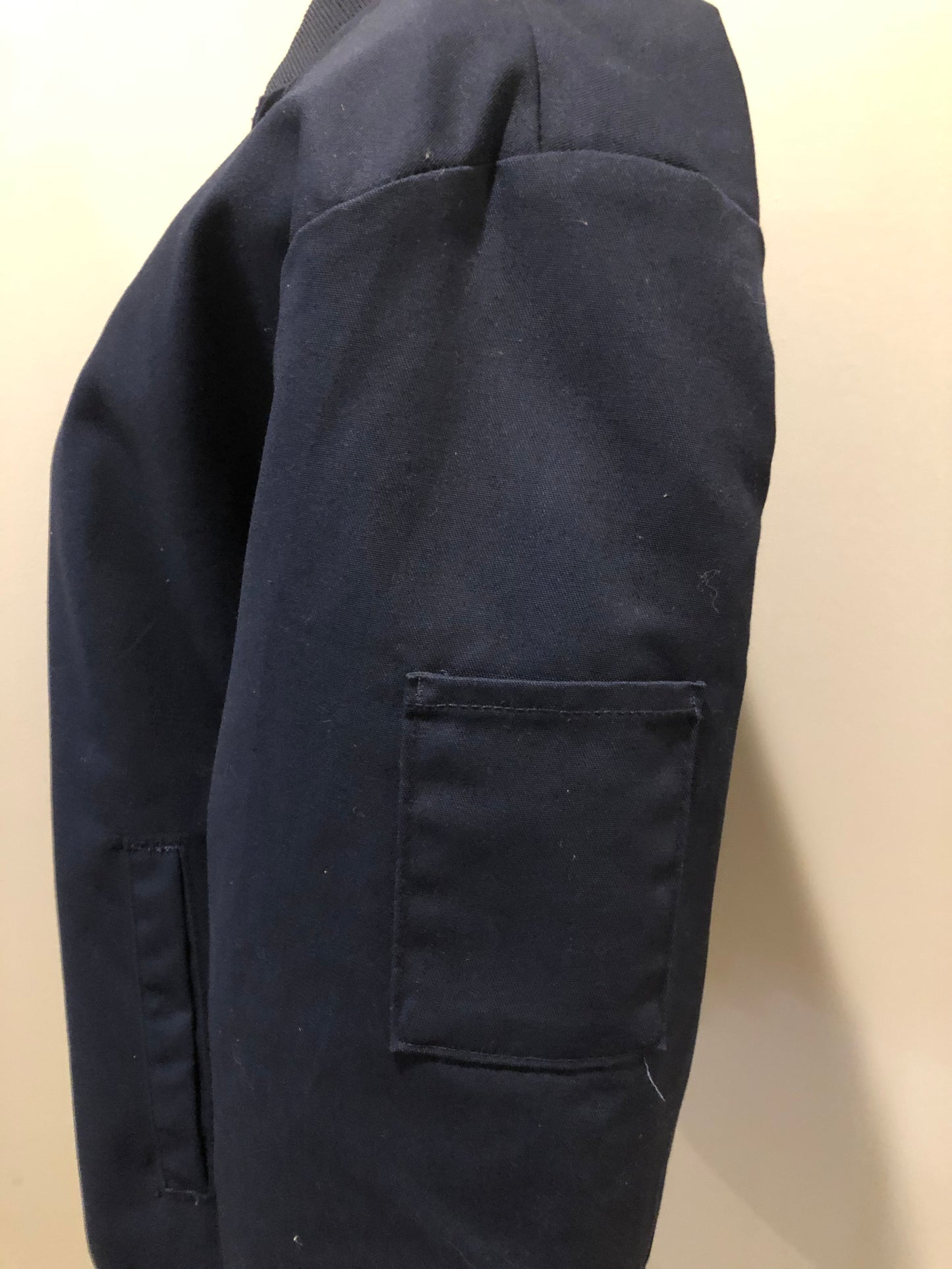 Kingspier Vintage - Red Kap bomber jacket in navy with knit collar and cuffs, zipper, slash pockets, and quilted lining. Made in the USA.
