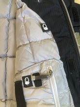 Load image into Gallery viewer, Kingspier Vintage - Bonfire “Triumph” black down filled, waterproof ski jacket with waterproof zippers,sling shot hood adjust, season pass window, many well thought out outside and inside pockets for headphone, phone, goggles, Etc. Size medium. 

