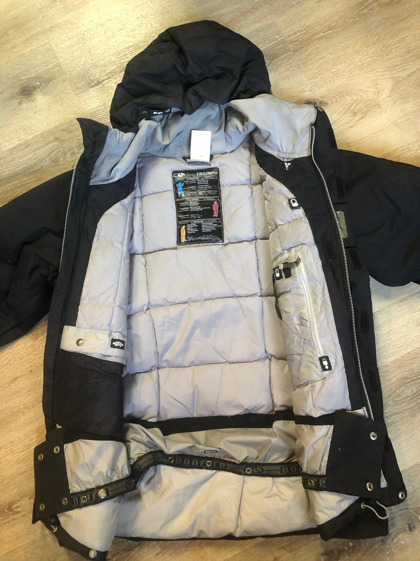 Kingspier Vintage - Bonfire “Triumph” black down filled, waterproof ski jacket with waterproof zippers,sling shot hood adjust, season pass window, many well thought out outside and inside pockets for headphone, phone, goggles, Etc. Size medium.