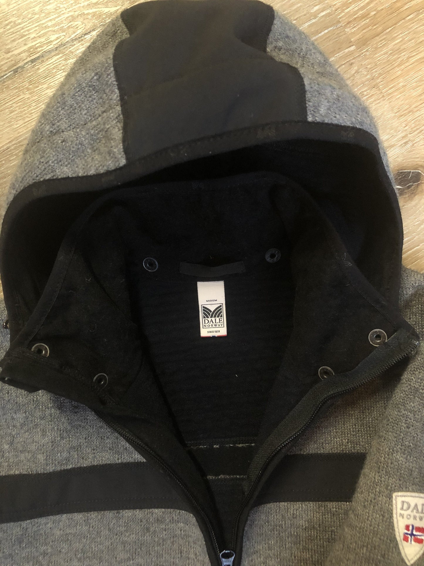 Kingspier Vintage - Dale of Norway weatherproof grey and black treated wool jacket with zipper, vertical pockets, thumb hole details, detachable hood and Dale of Norway crest on shoulder.