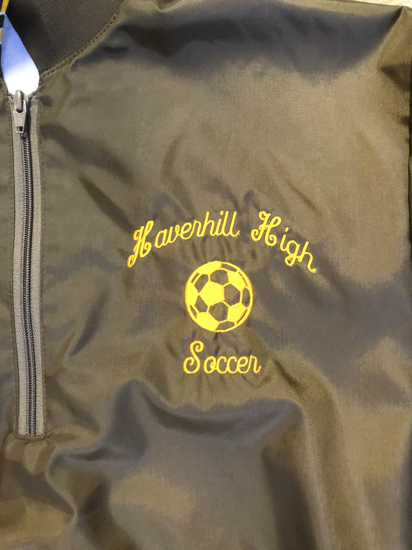 Kingspier Vintage - Havenhill High Soccer varsity jacket in brown with yellow stripe, zipper, front pouch pocket, “Havenhill High” written across the back and “Steph” monogram on the arm. Made in the USA. Size large.