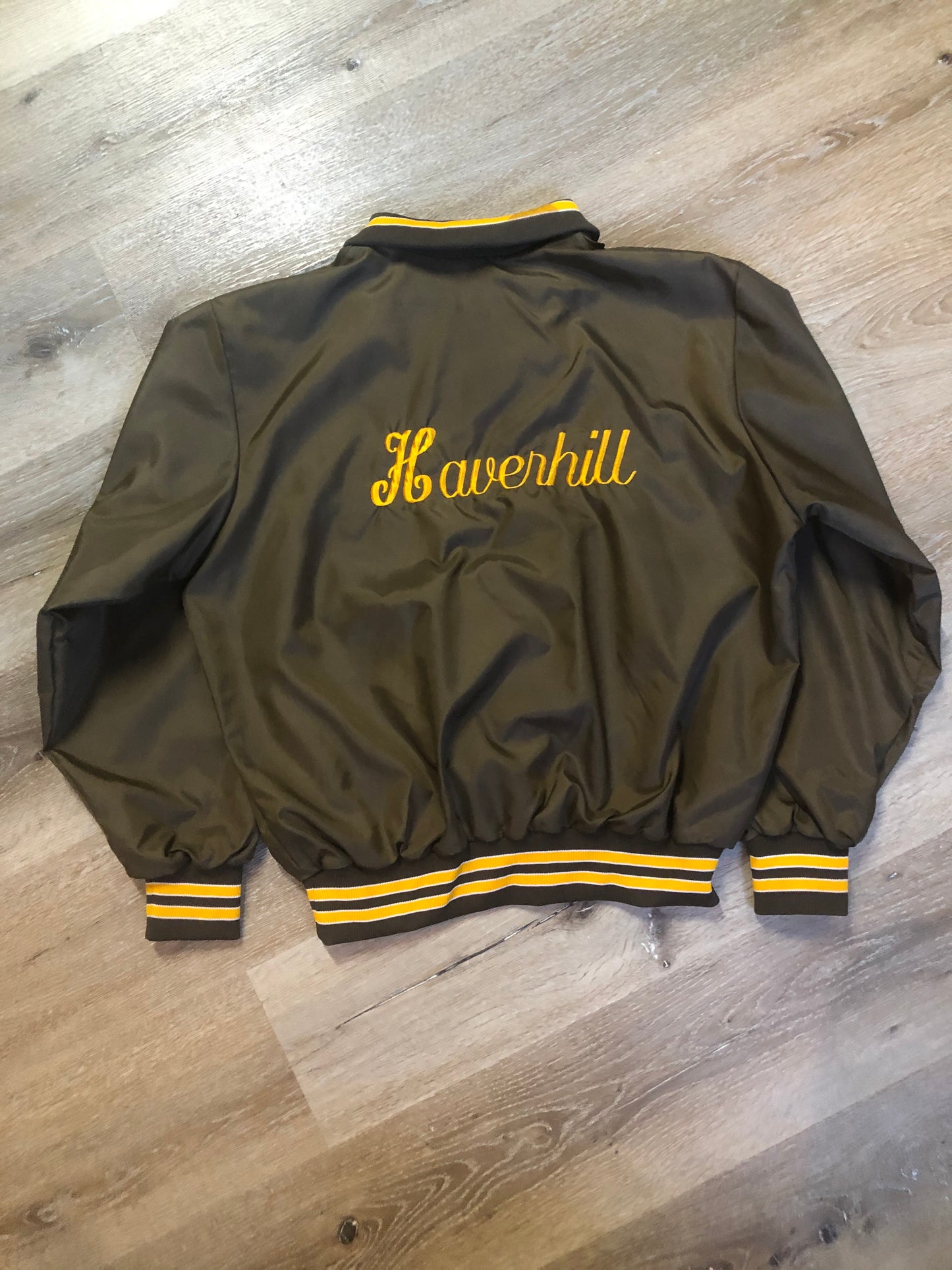 Kingspier Vintage - Havenhill High Soccer varsity jacket in brown with yellow stripe, zipper, front pouch pocket, “Havenhill High” written across the back and “Steph” monogram on the arm. Made in the USA. Size large.