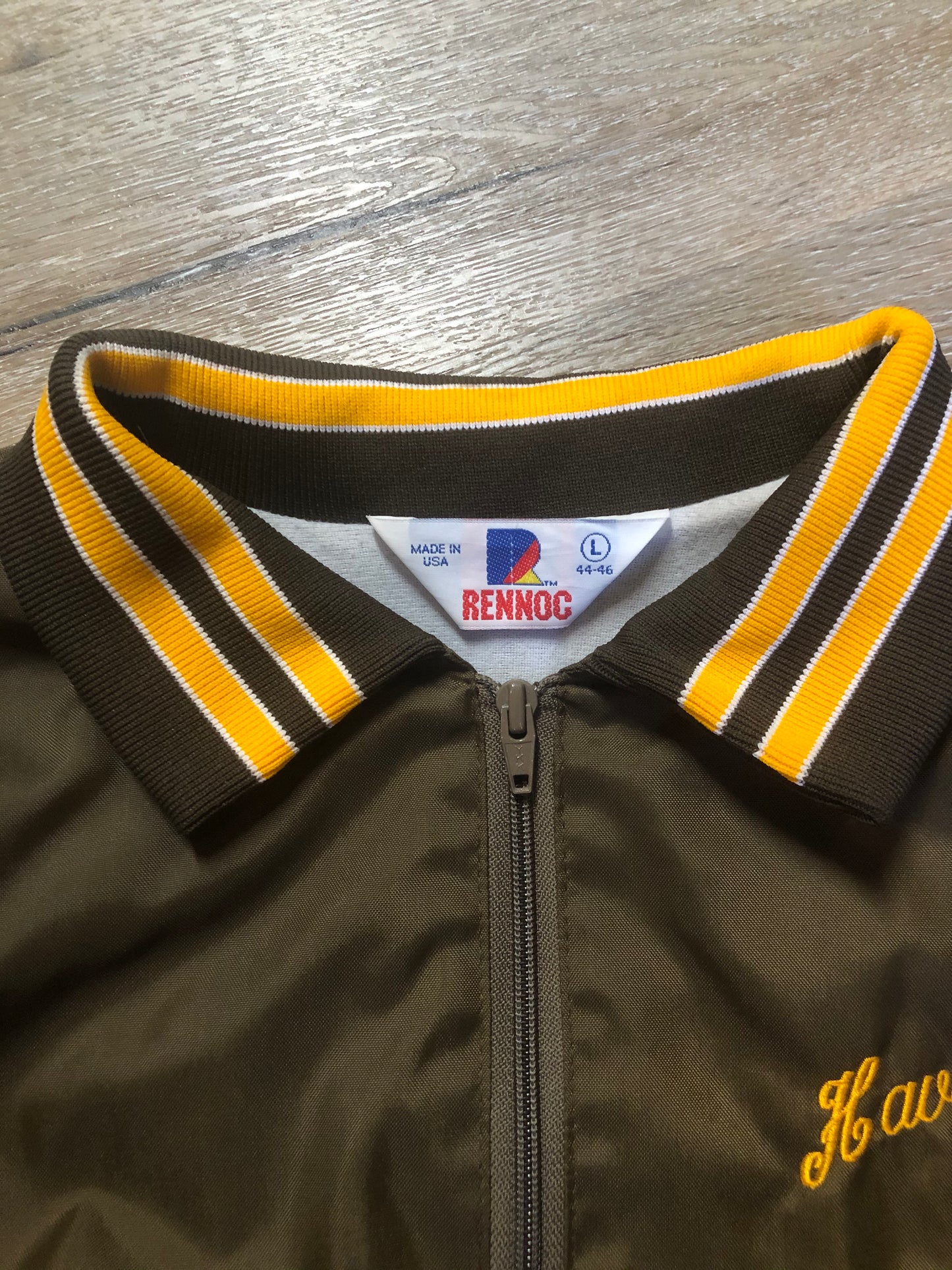 Kingspier Vintage - Havenhill High Soccer varsity jacket in brown with yellow stripe, zipper, front pouch pocket, “Havenhill High” written across the back and “Steph” monogram on the arm. Made in the USA. Size large.