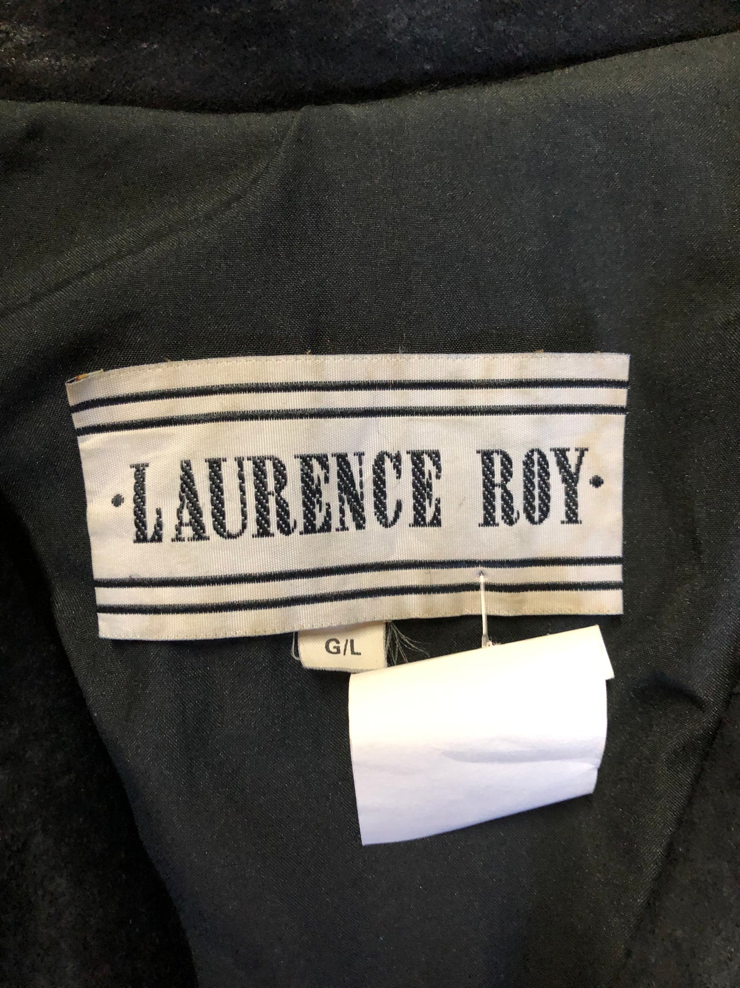 Kingspier Vintage - Laurence Roy black lamb leather suede jacket circa 1980’s with fringe detailing, button closures and slash pockets. Made in Canada. Size large.