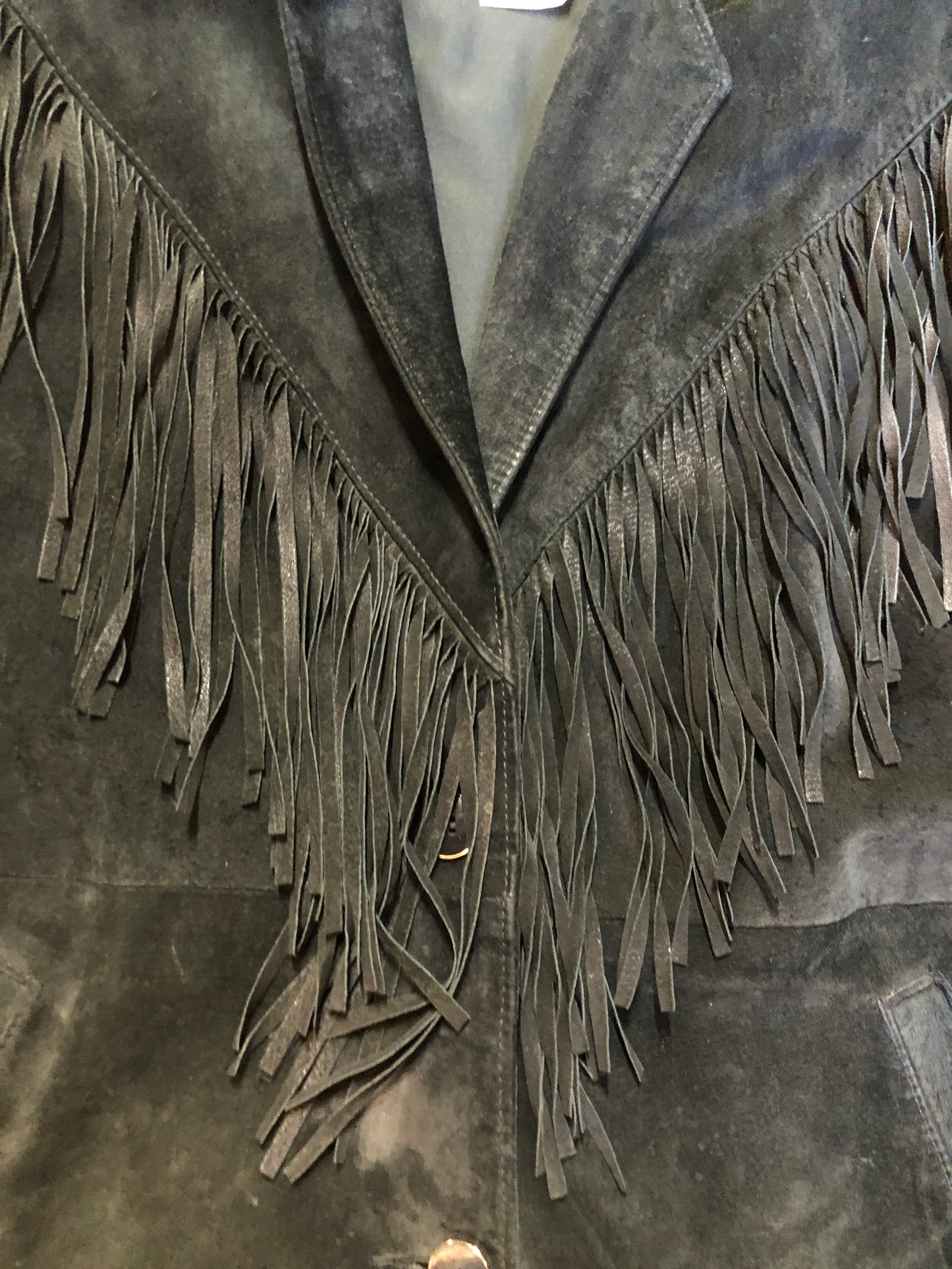 Kingspier Vintage - Laurence Roy black lamb leather suede jacket circa 1980’s with fringe detailing, button closures and slash pockets. Made in Canada. Size large.