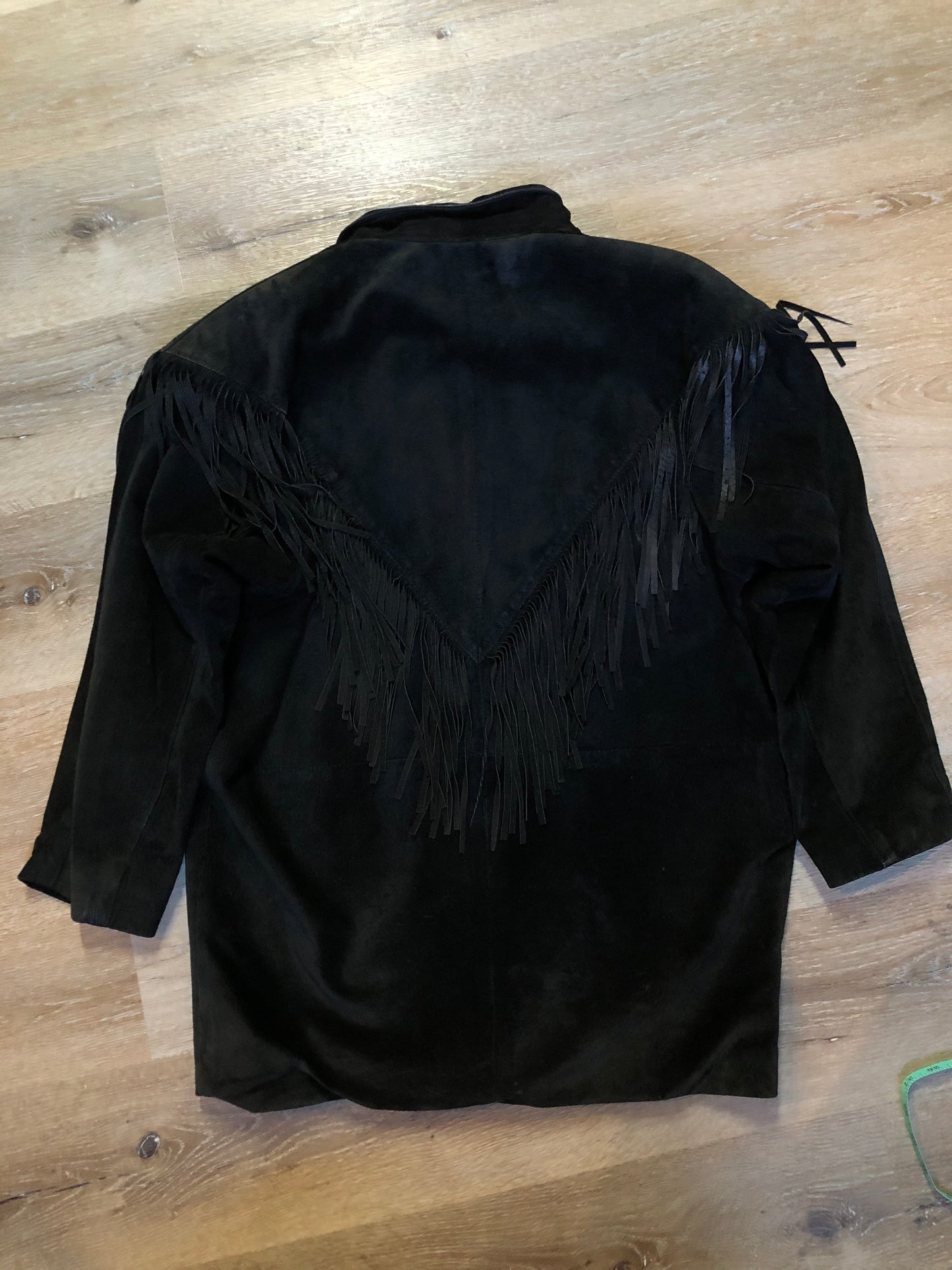Kingspier Vintage - Laurence Roy black lamb leather suede jacket circa 1980’s with fringe detailing, button closures and slash pockets. Made in Canada. Size large.