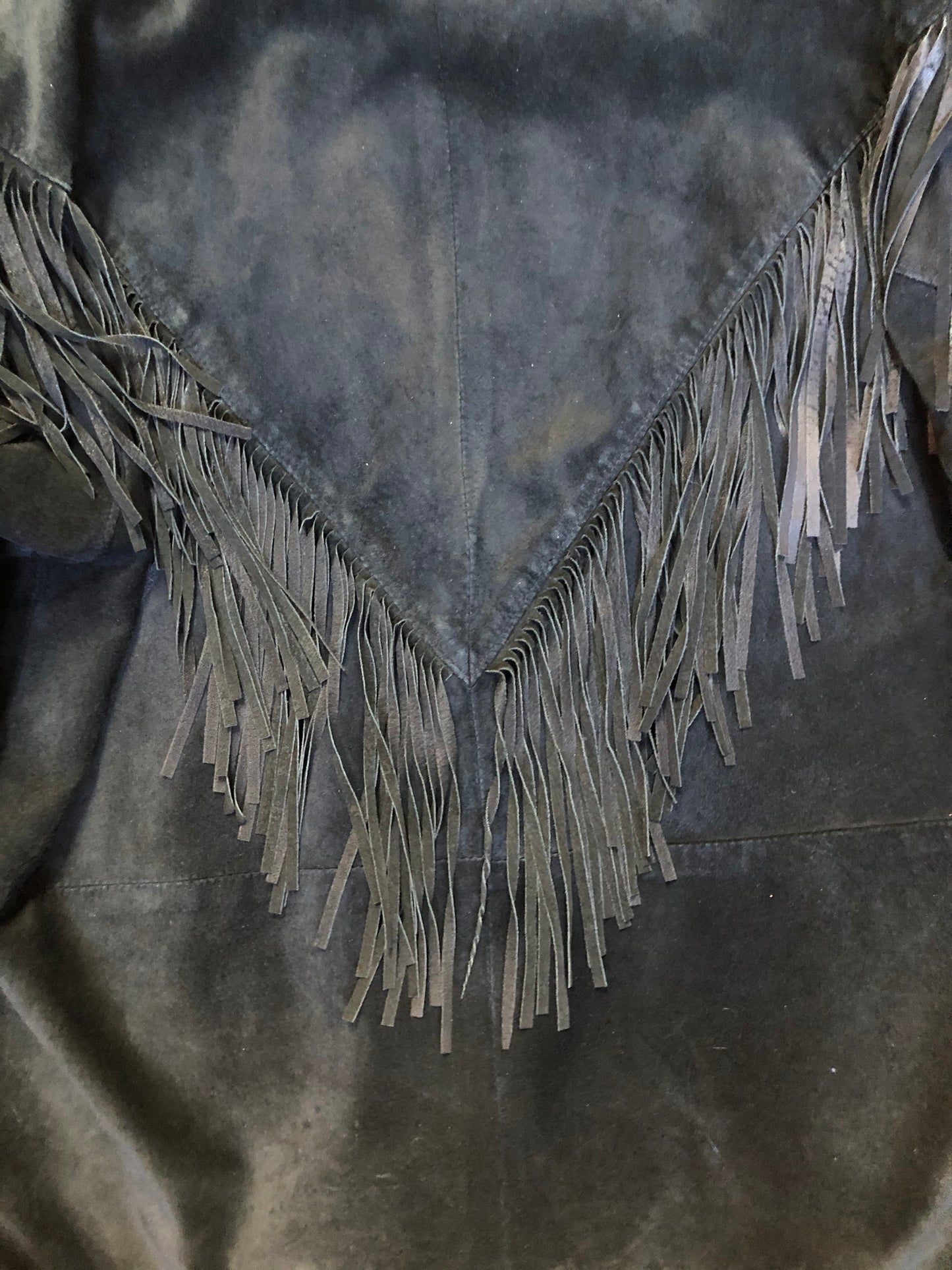 Kingspier Vintage - Laurence Roy black lamb leather suede jacket circa 1980’s with fringe detailing, button closures and slash pockets. Made in Canada. Size large.